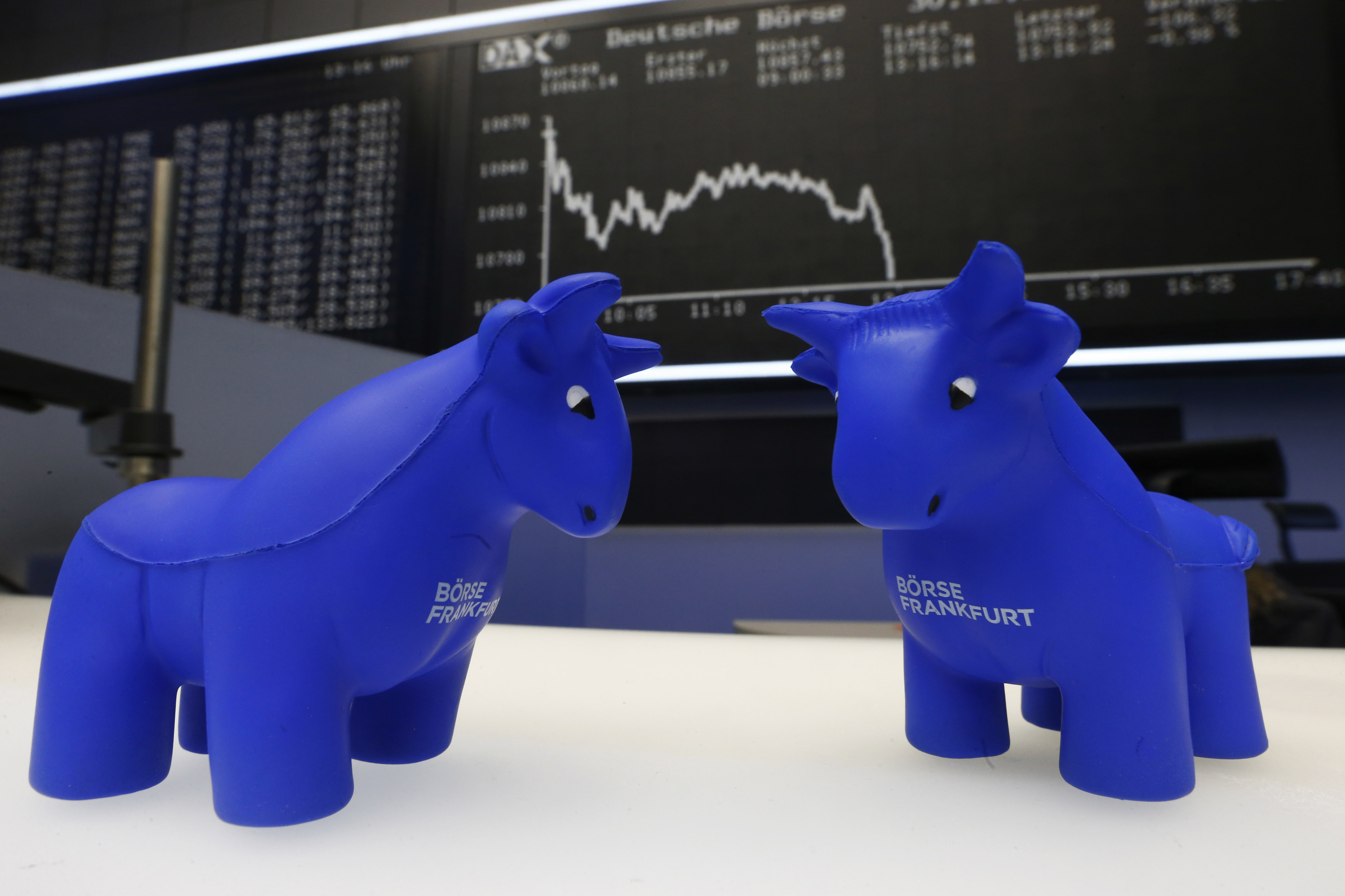 Foam bull figures are seen in front of the German DAX Index board during the last trading day at Frankfurt's stock exchange
