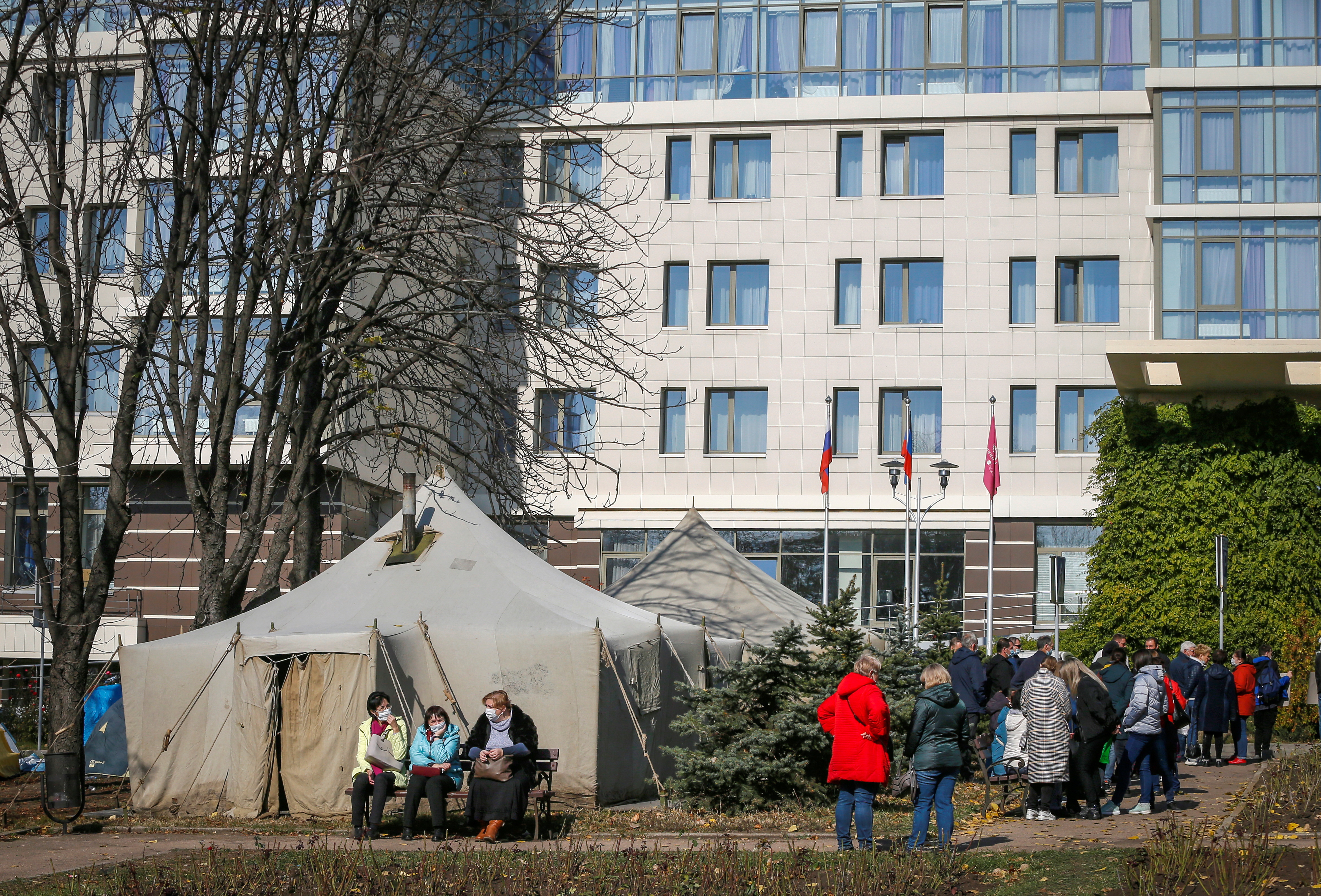 Protesters set up tents in front of the Park Inn hotel housing OSCE monitor mission during a rally to demand release of a pro-Russian officer, captured by the Ukrainian military this week, in the rebel-controlled city of Donetsk, Ukraine October 16, 2021.  REUTERS/Alexander Ermochenko