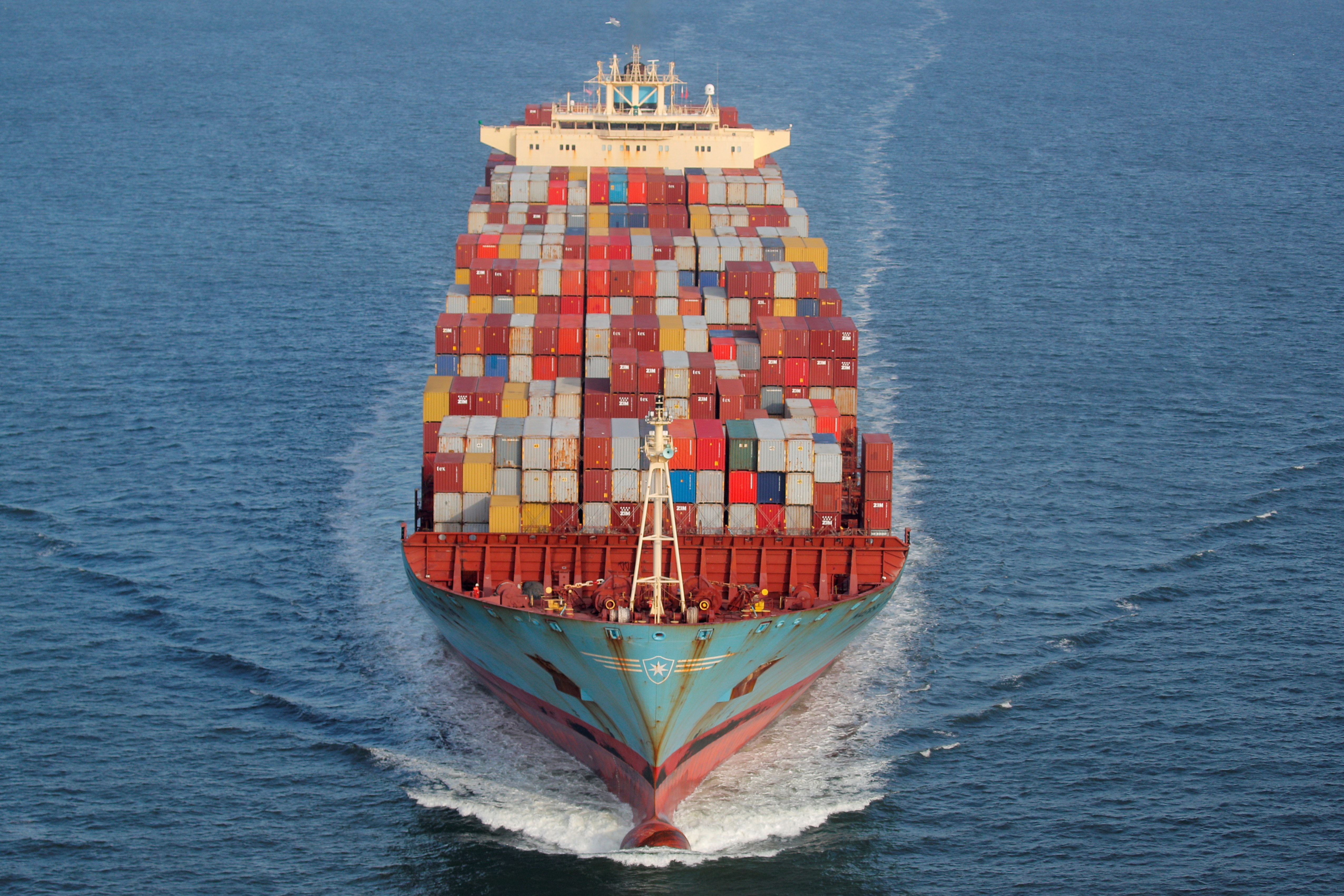 Containers are stacked on the deck of the cargo ship as it's underway in New York Harbor in New York