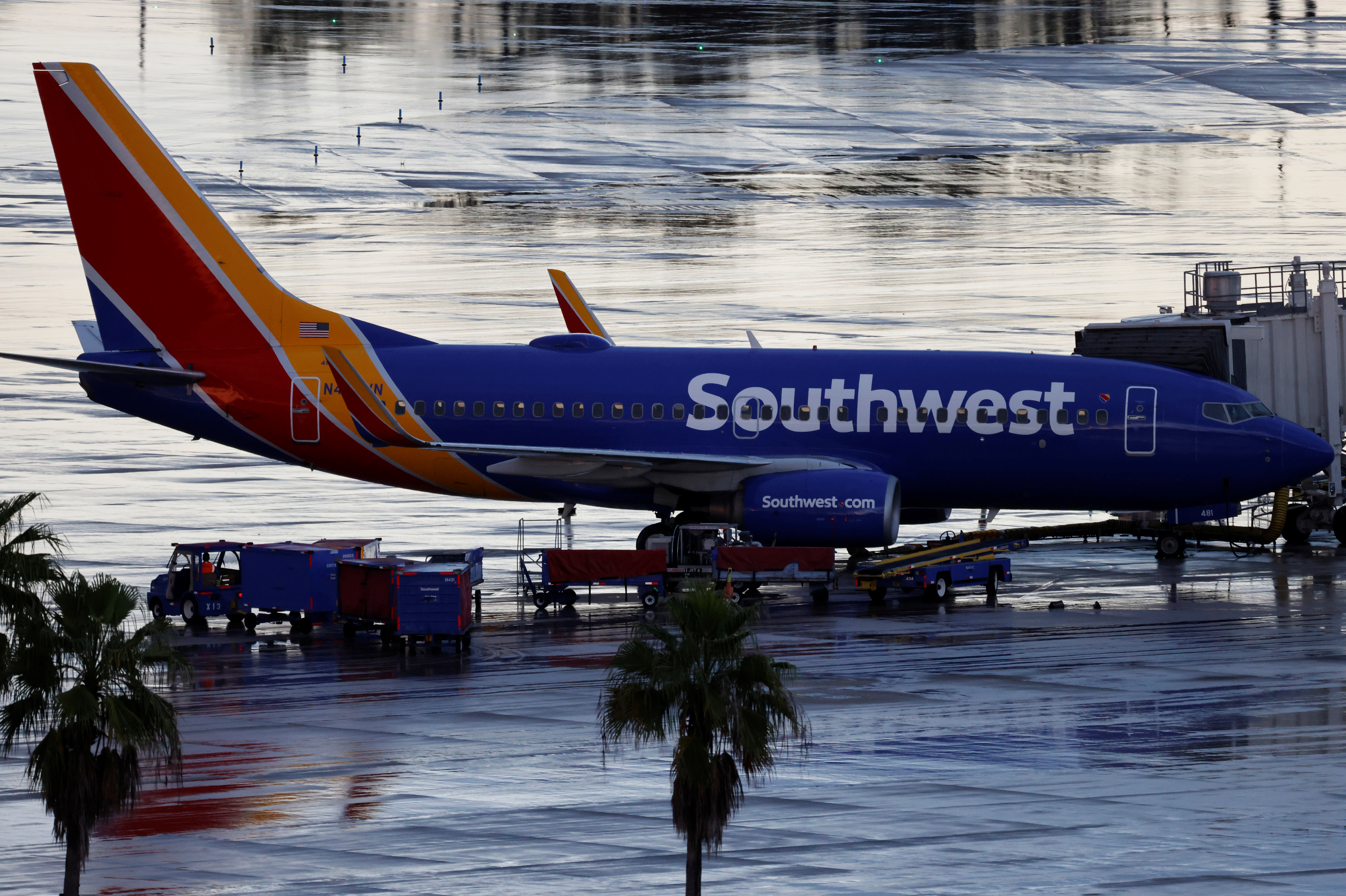 A Southwest Airlines jet sits at a gate at Orlando International Airport in Orlando