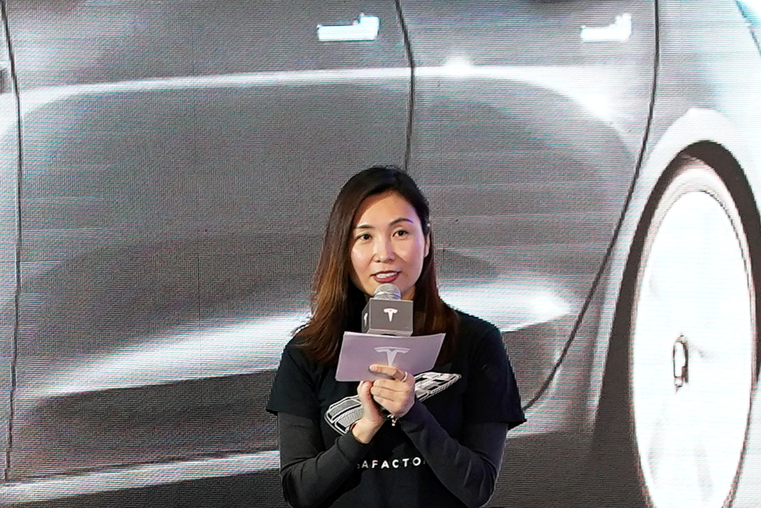 Tesla Inc's Grace Tao attends a delivery ceremony for the EV maker's China-made Model 3 cars in Shanghai