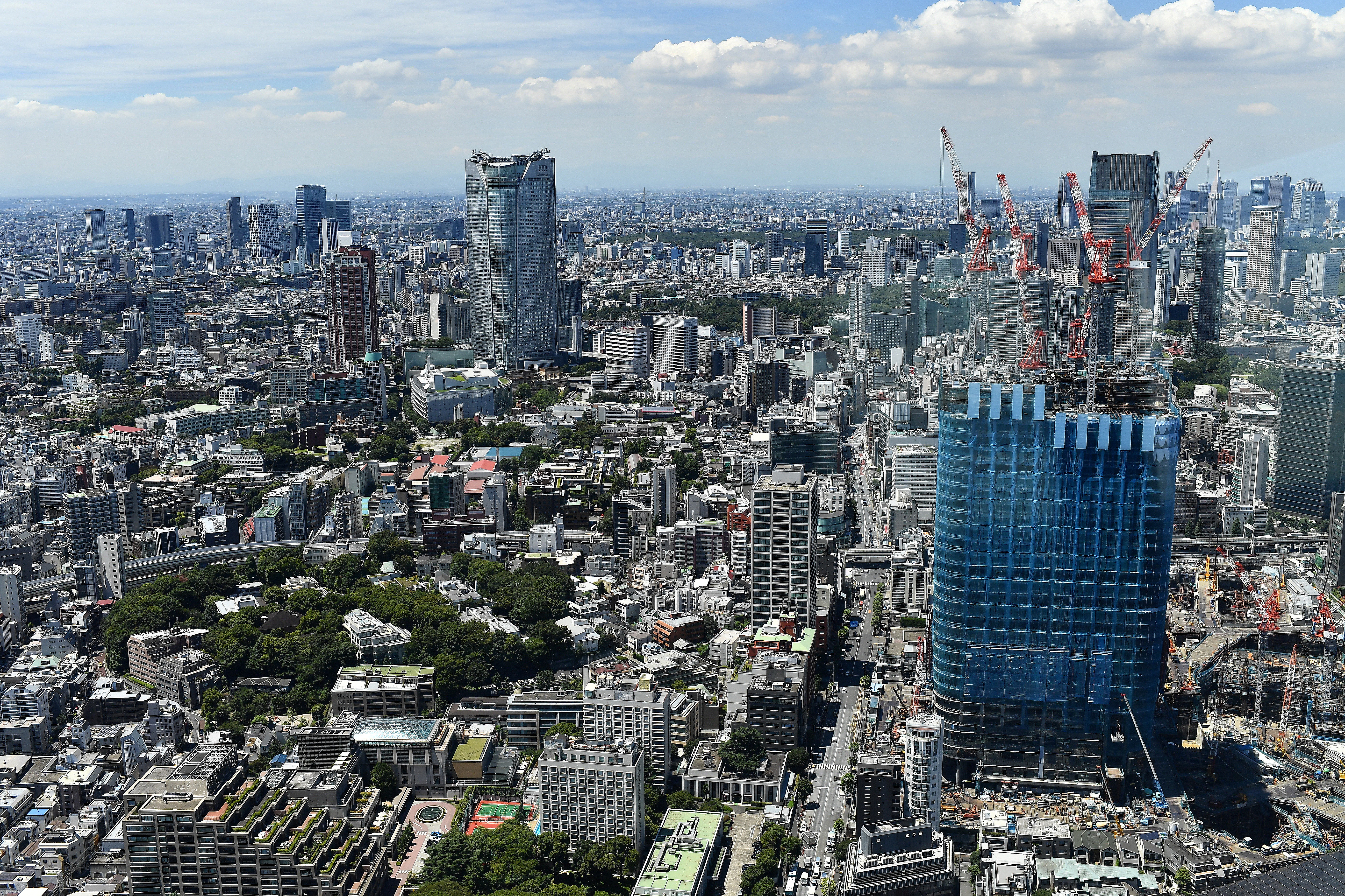 Buildings under construction are seen in a general view from Tokyo Tower of the city of Tokyo, Japan, August 6, 2021. Picture taken August 6, 2021. REUTERS/Clodagh Kilcoyne