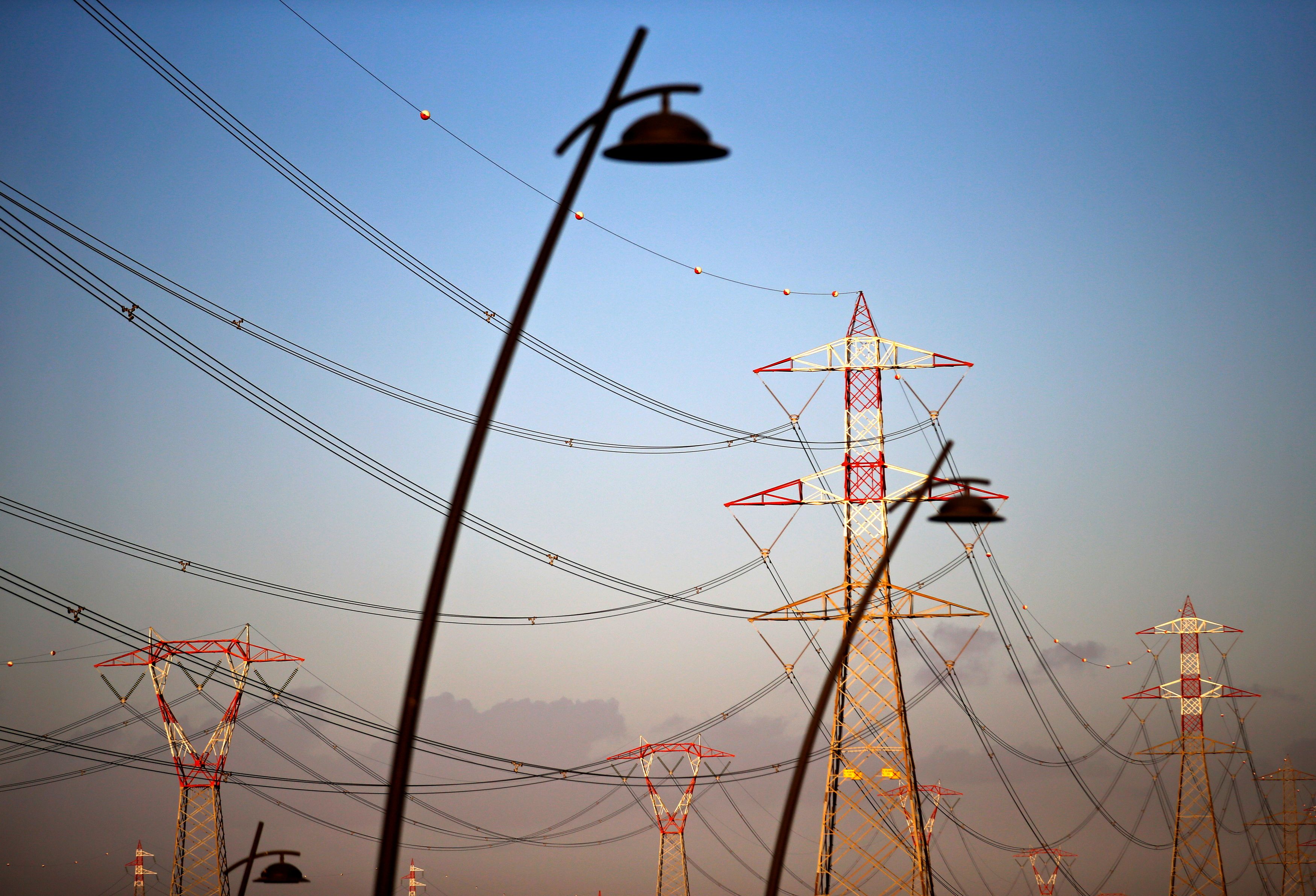 Power lines connecting pylons of high-tension electricity are seen in Montalto Di Castro