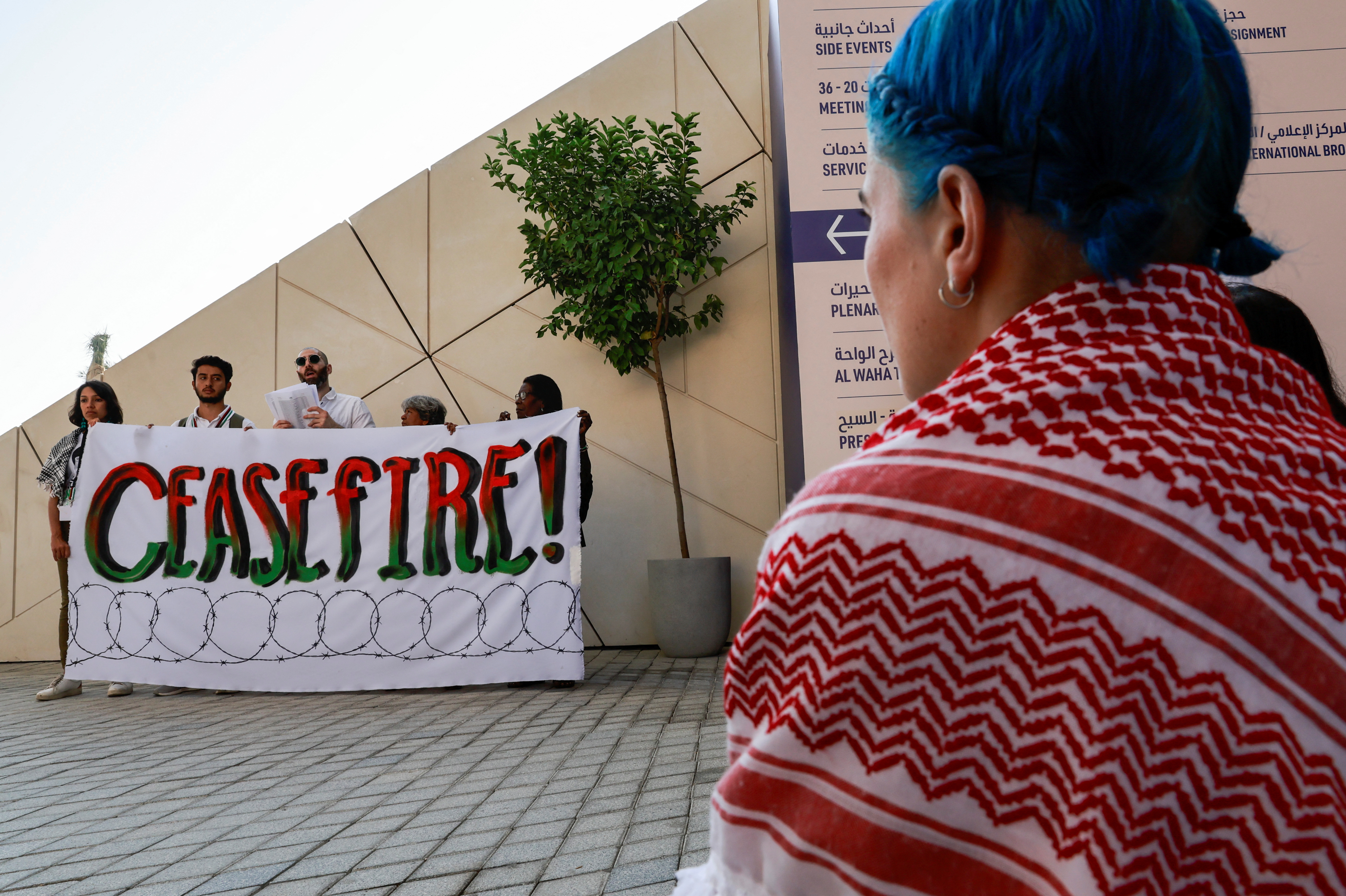Climate activists protest in support of Palestinians in Gaza at COP28 in Dubai