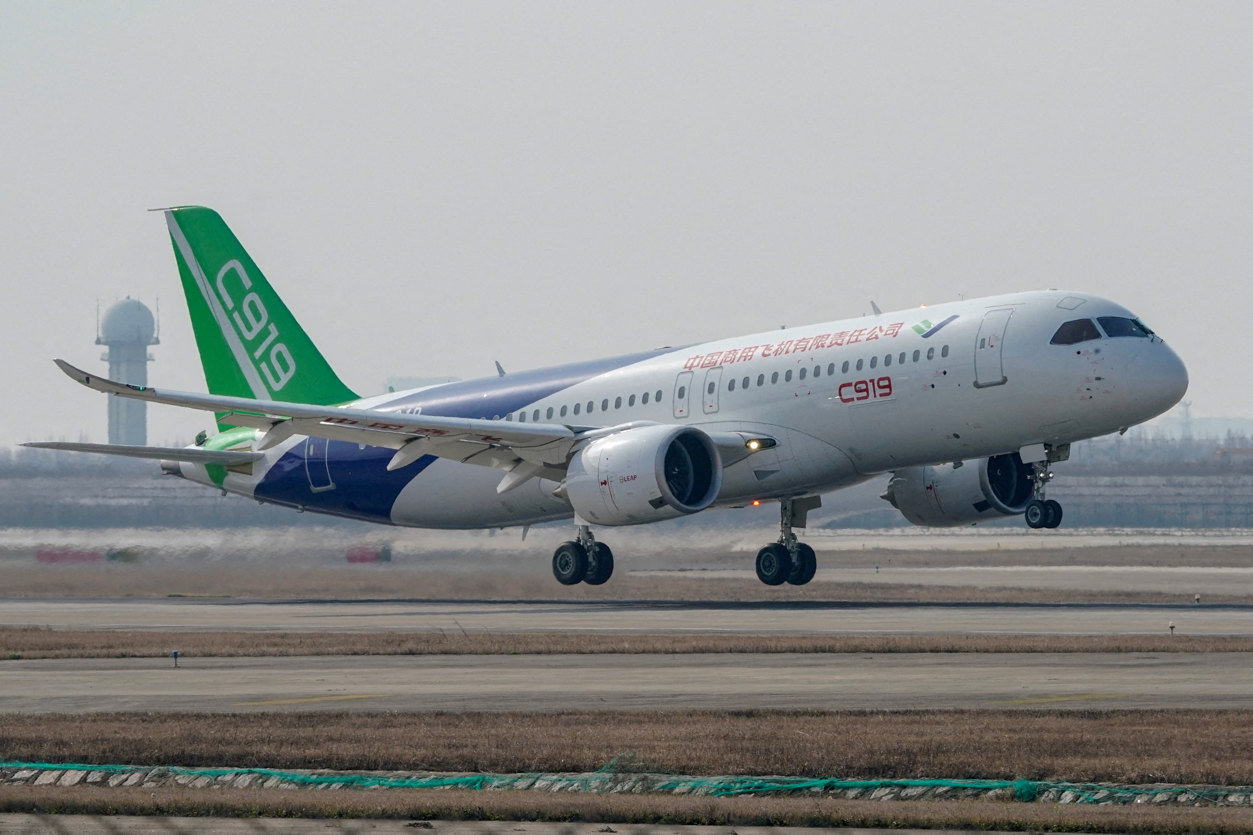 The third prototype of China's home-built passenger jet C919 takes off during its first test flight at Shanghai Pudong International Airport