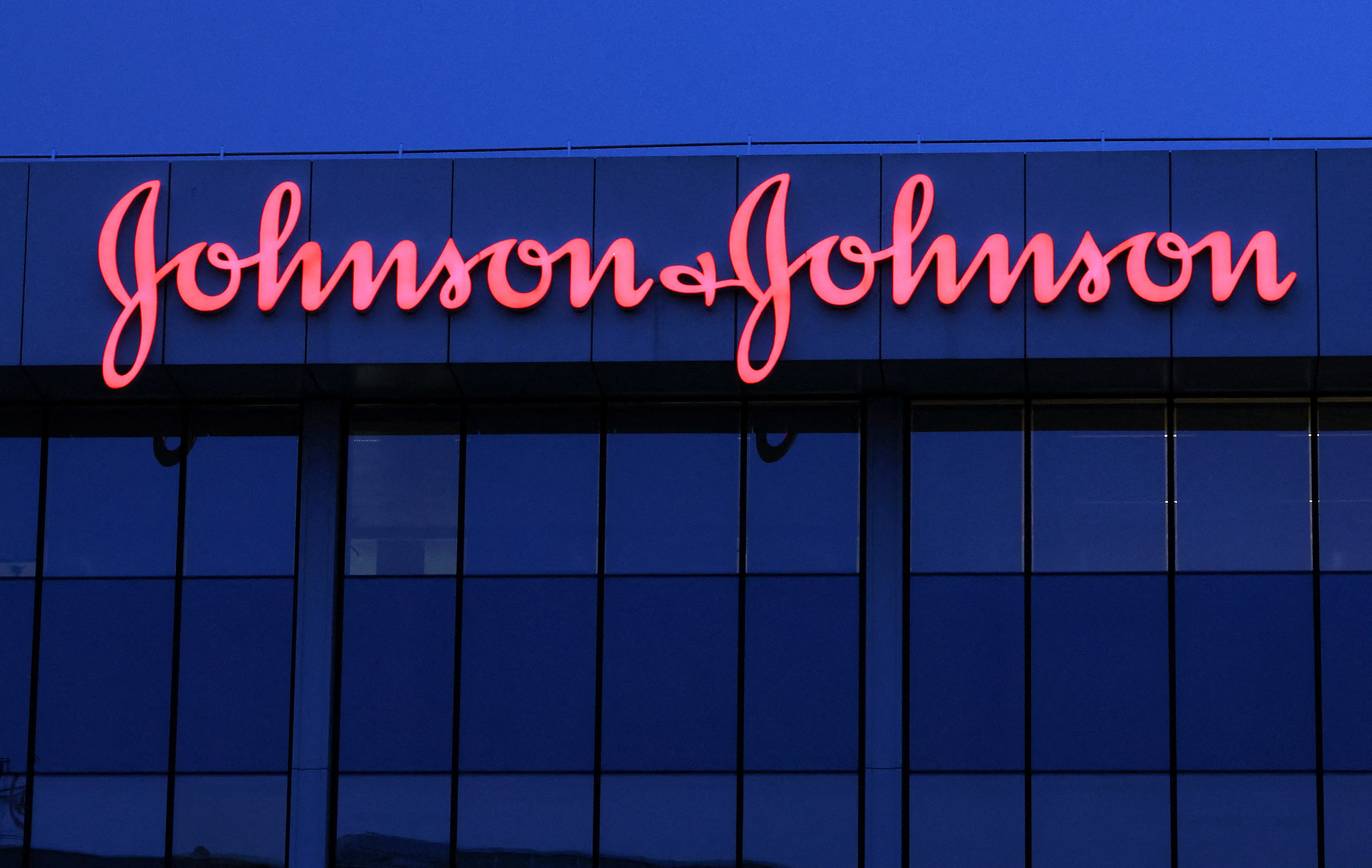 The logo of Johnson & Johnson is seen on the top of a Brussels' office of the company in Diegem