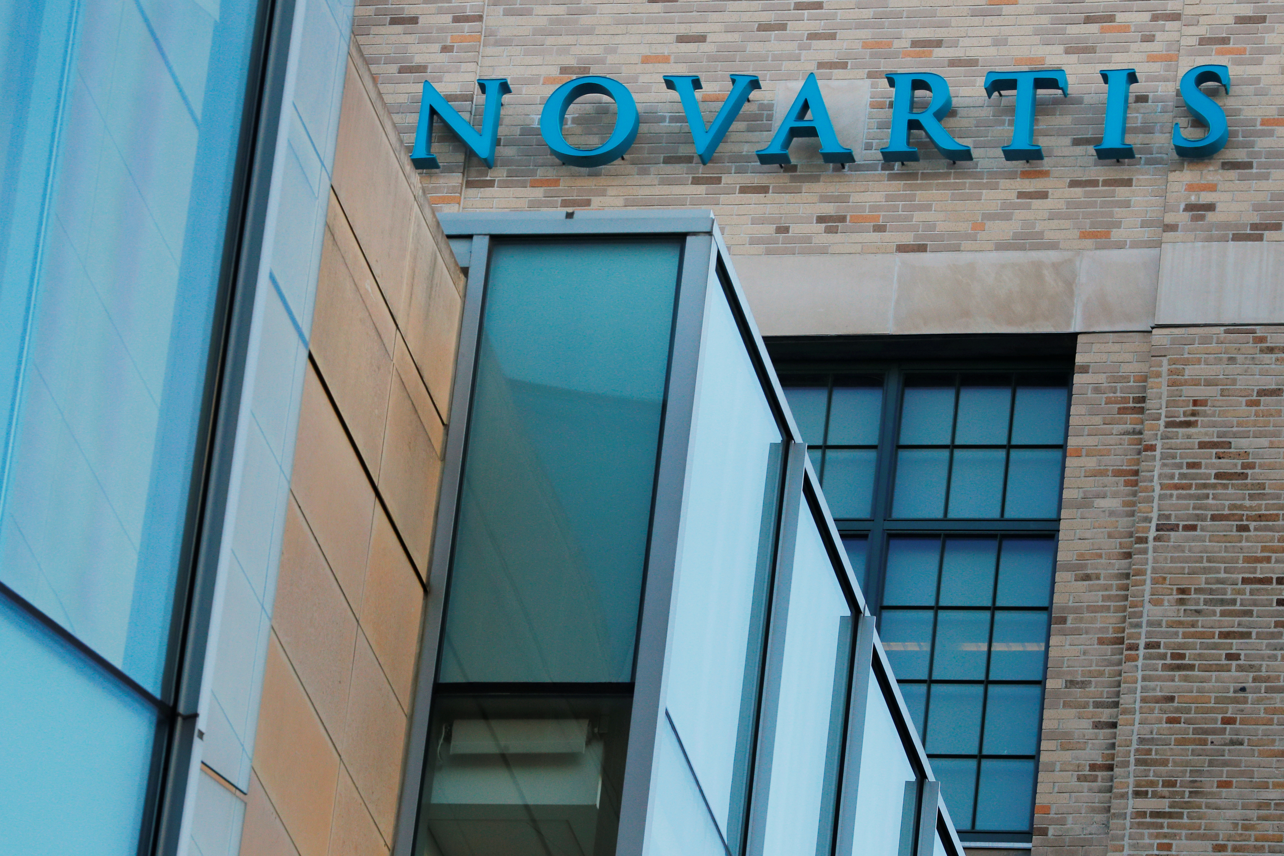 A sign marks Novartis' Institutes for Biomedical Research in Cambridge