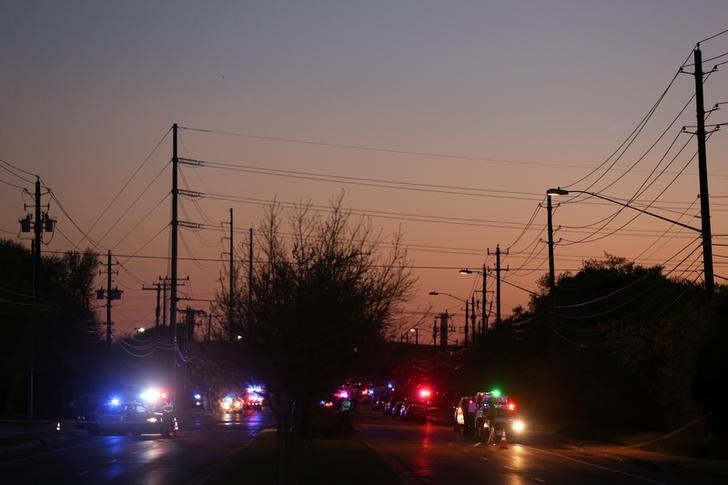 Law enforcement personnel investigate an incident  in Austin