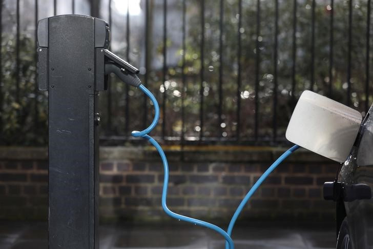 A car is plugged in at a charging point for electric vehicles in London