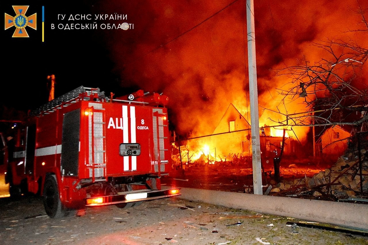 Firefighters work at a scene after a shelling in a location given as Odesa