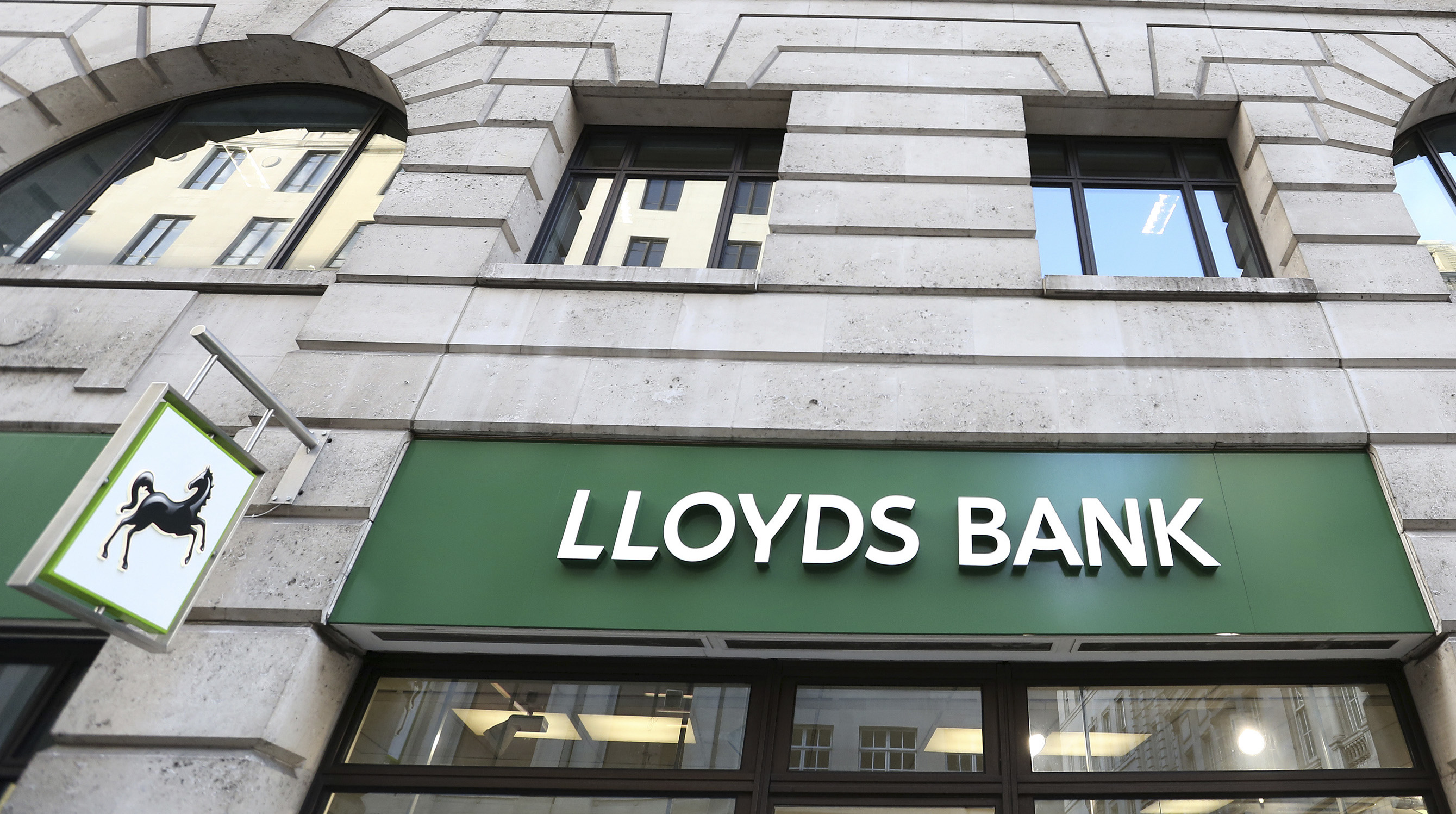 The signage is seen at a branch of Lloyds bank in central London