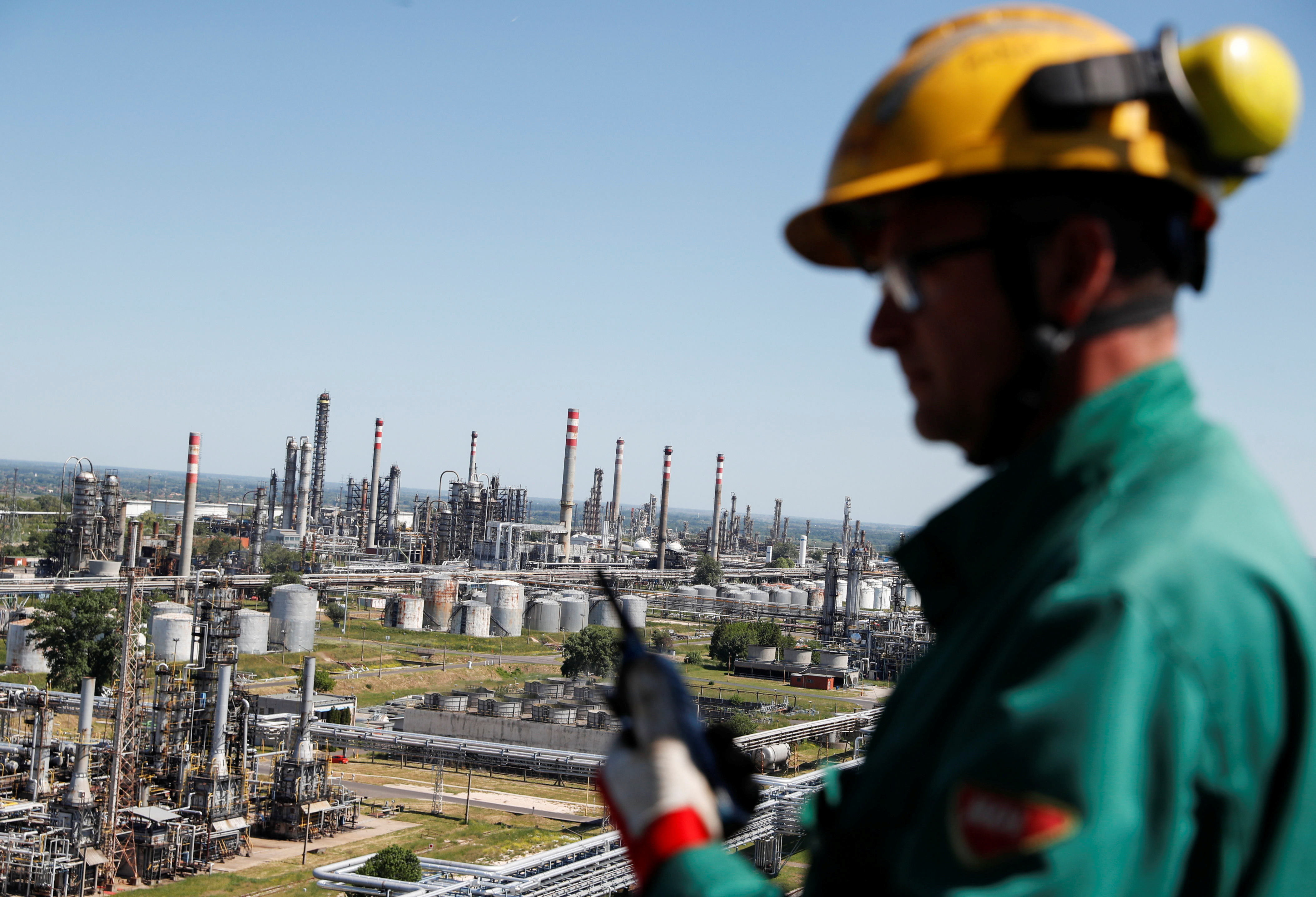 An employee looks on at Hungarian MOL Group's Danube Refinery in Szazhalombatta