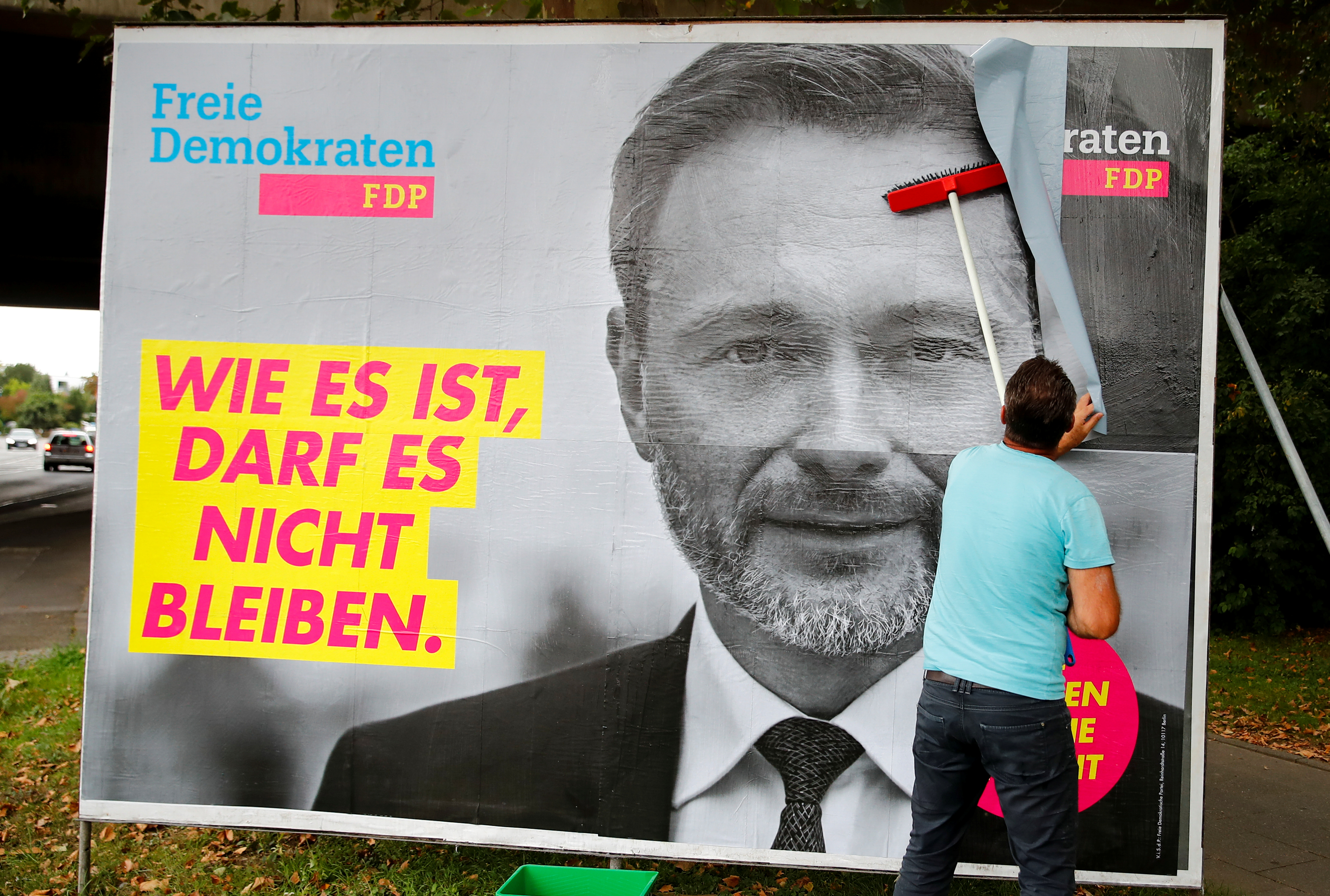 Placards being placed on boards in Bonn for Germany’s general election on September 26