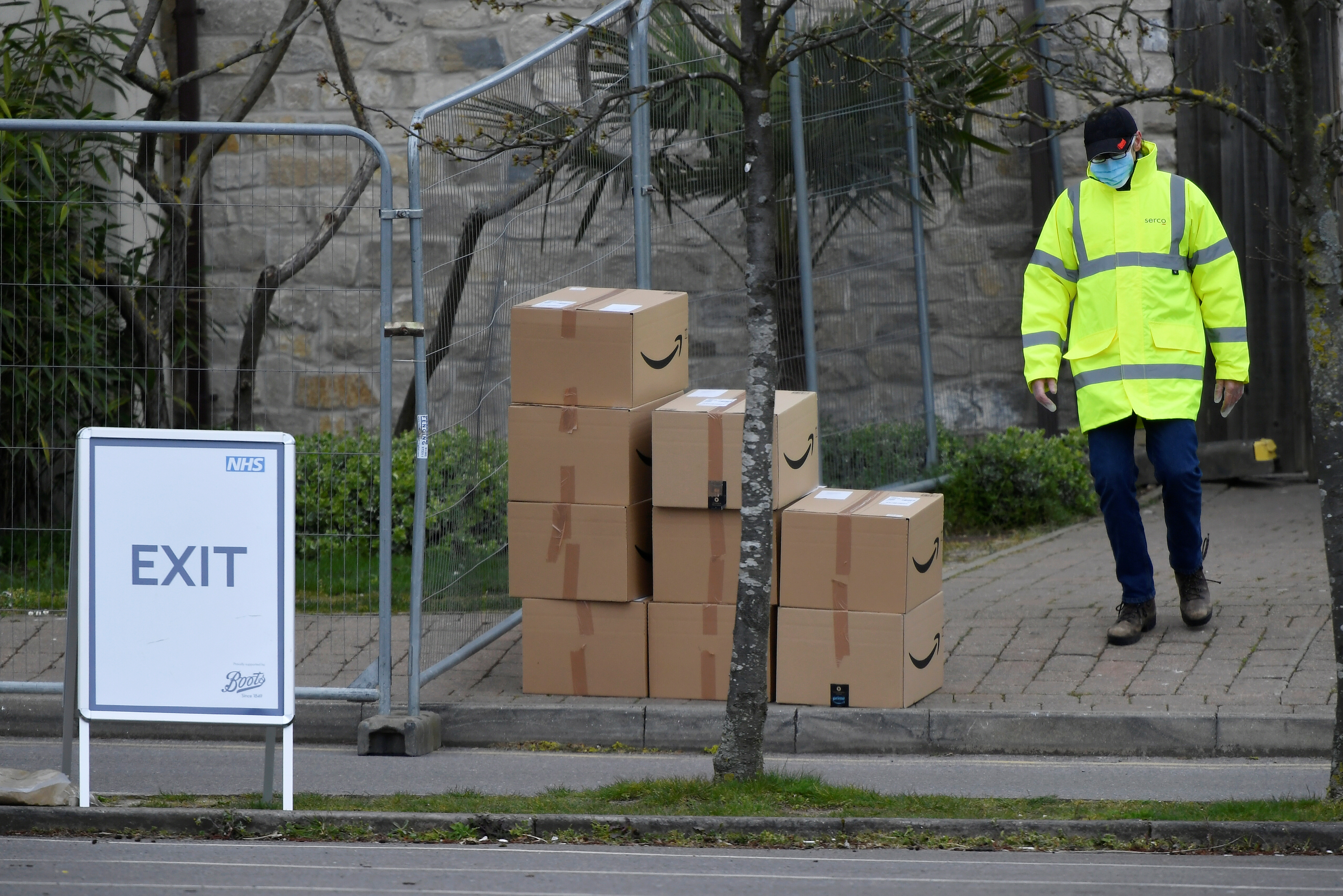  Boxes with a Amazon logo are seen arriving at a coronavirus test centre in the car park of Chessington World of Adventures as the spread of the coronavirus disease (COVID-19) continues, Chessington, Britain, April 2, 2020. REUTERS/Toby Melville/Files