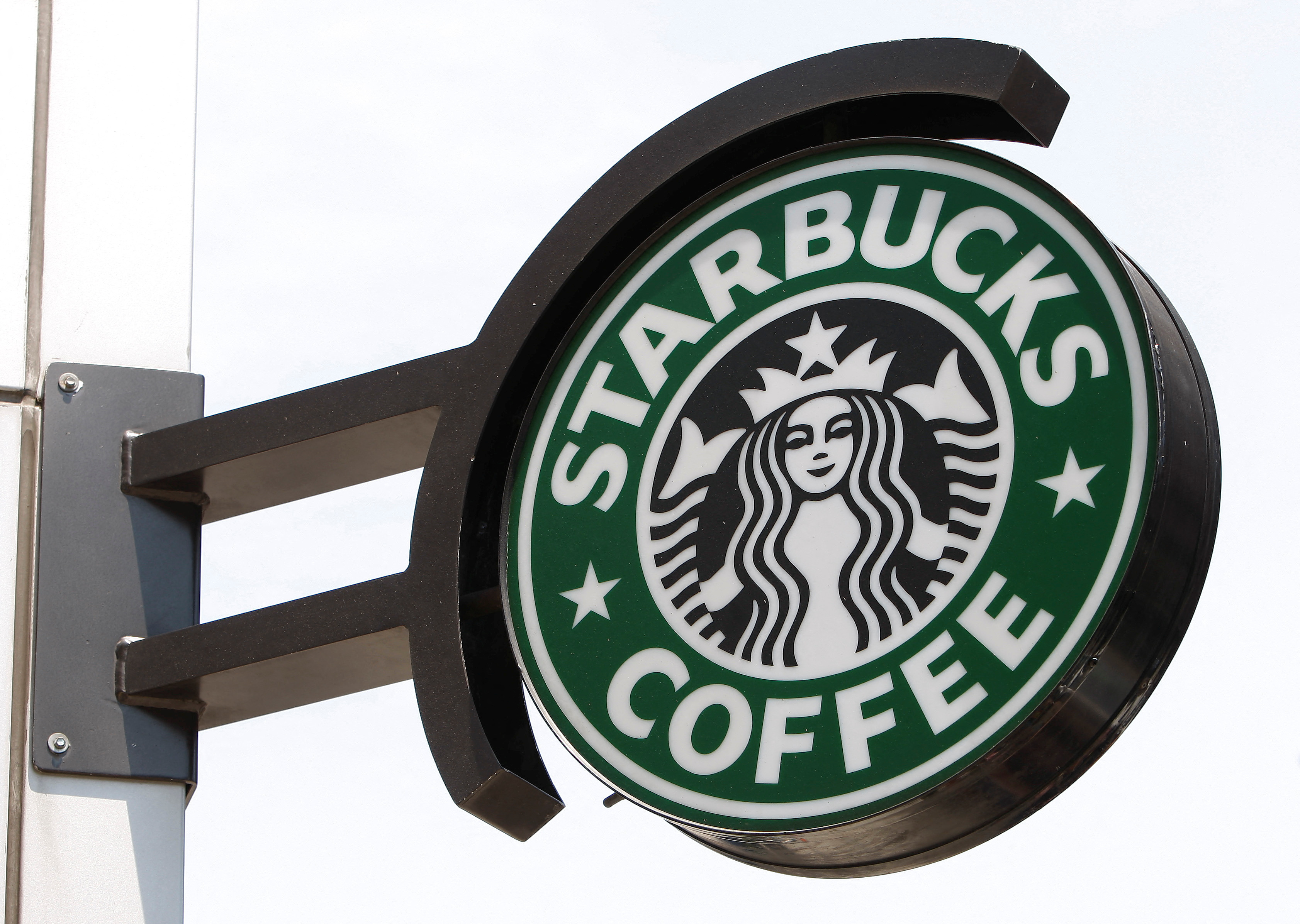 The Starbucks sign is seen outside one of its stores in New York
