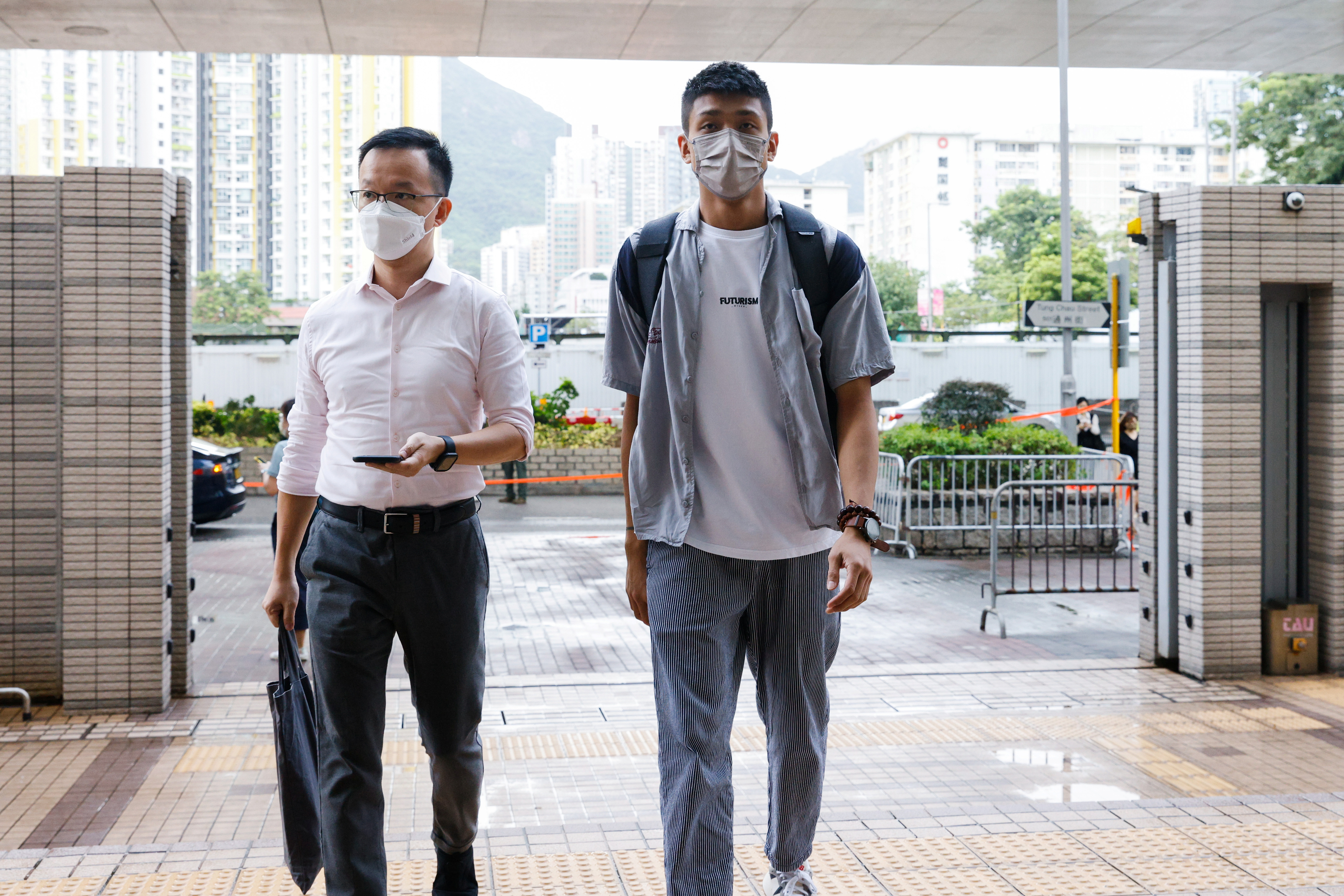 Pro-democracy activist Raymond Chan Chi-chuen and Owen Chow, two of the 47 pro-democracy activists charged with conspiracy to commit subversion under the national security law, arrive West Kowloon Magistrates's Courts building, in Hong Kong