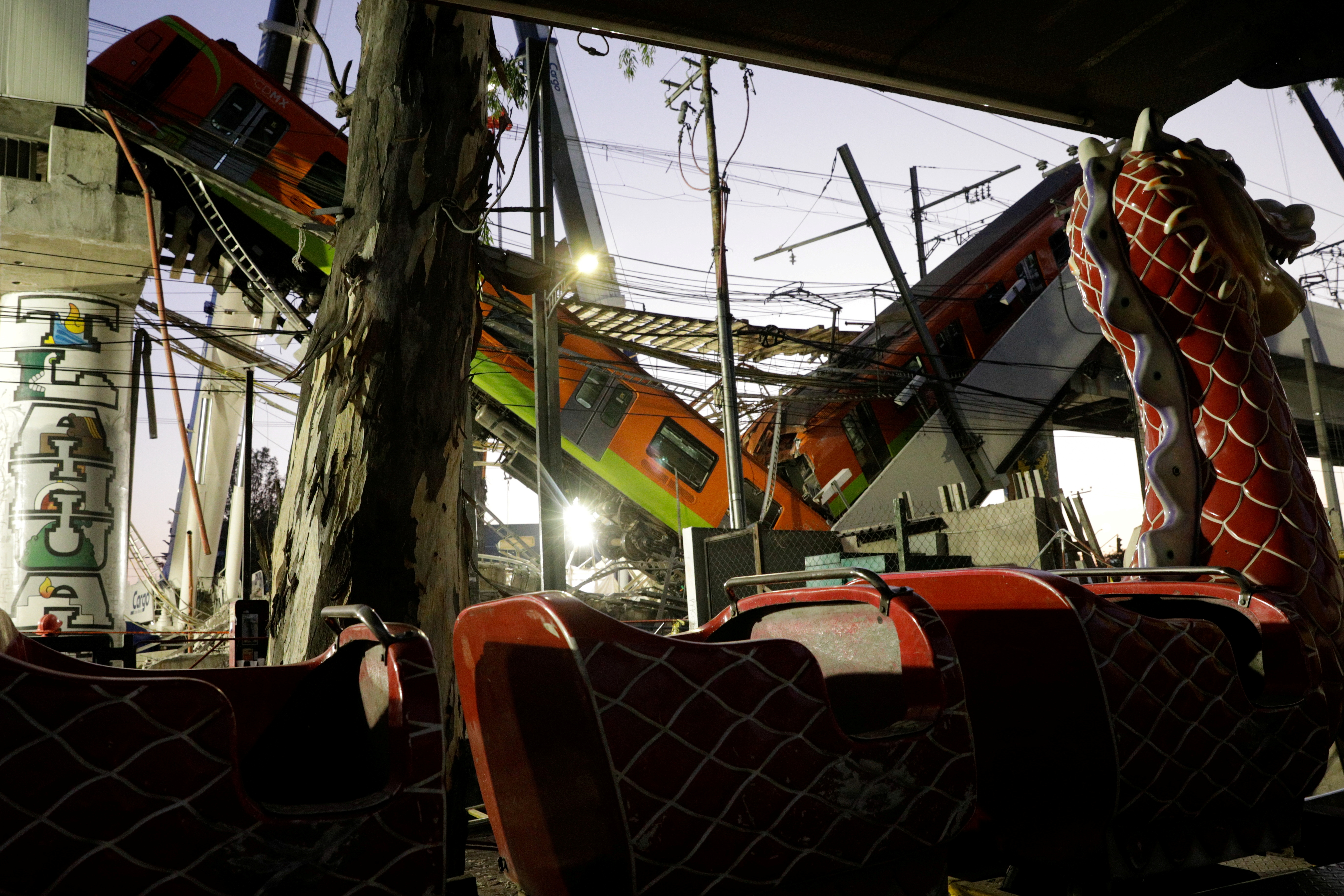 A train is seen at the site where an overpass for a metro partially collapsed at Olivos station in Mexico City, Mexico, May 4, 2021. REUTERS/Luis Cortes 