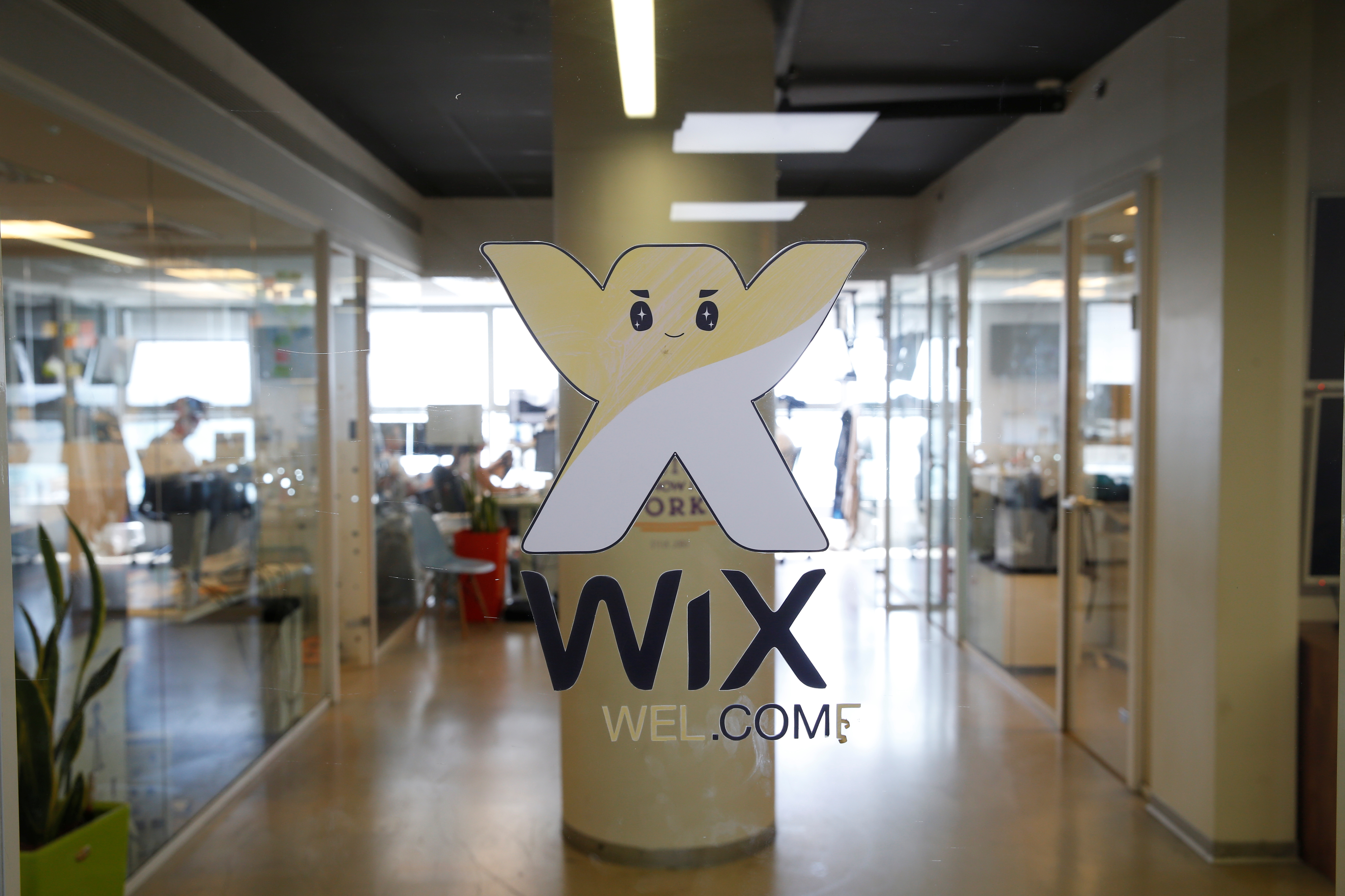 Employees work at website-designer firm Wix.com offices in Tel Aviv