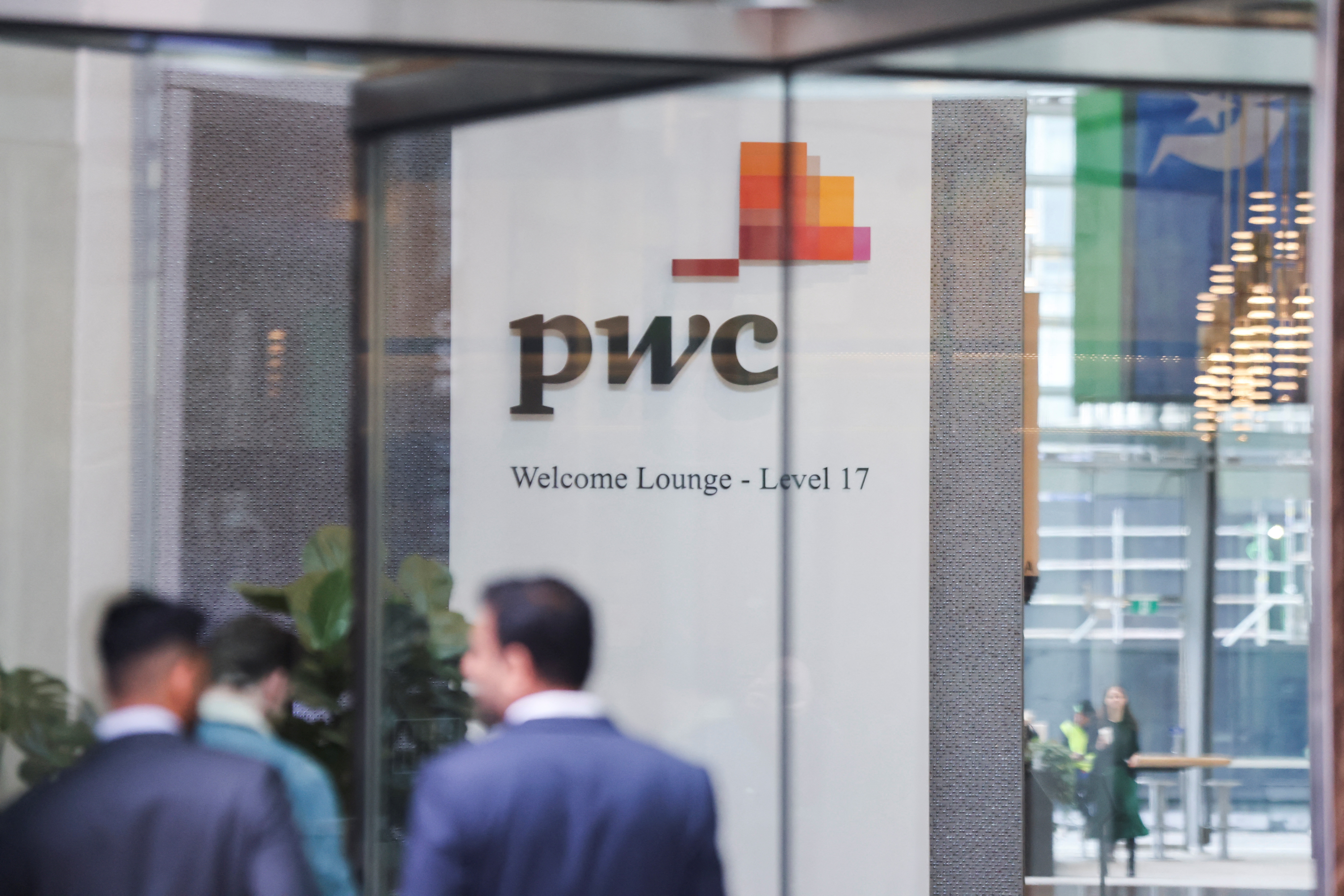 PwC sign is seen in the lobby of their offices in Barangaroo