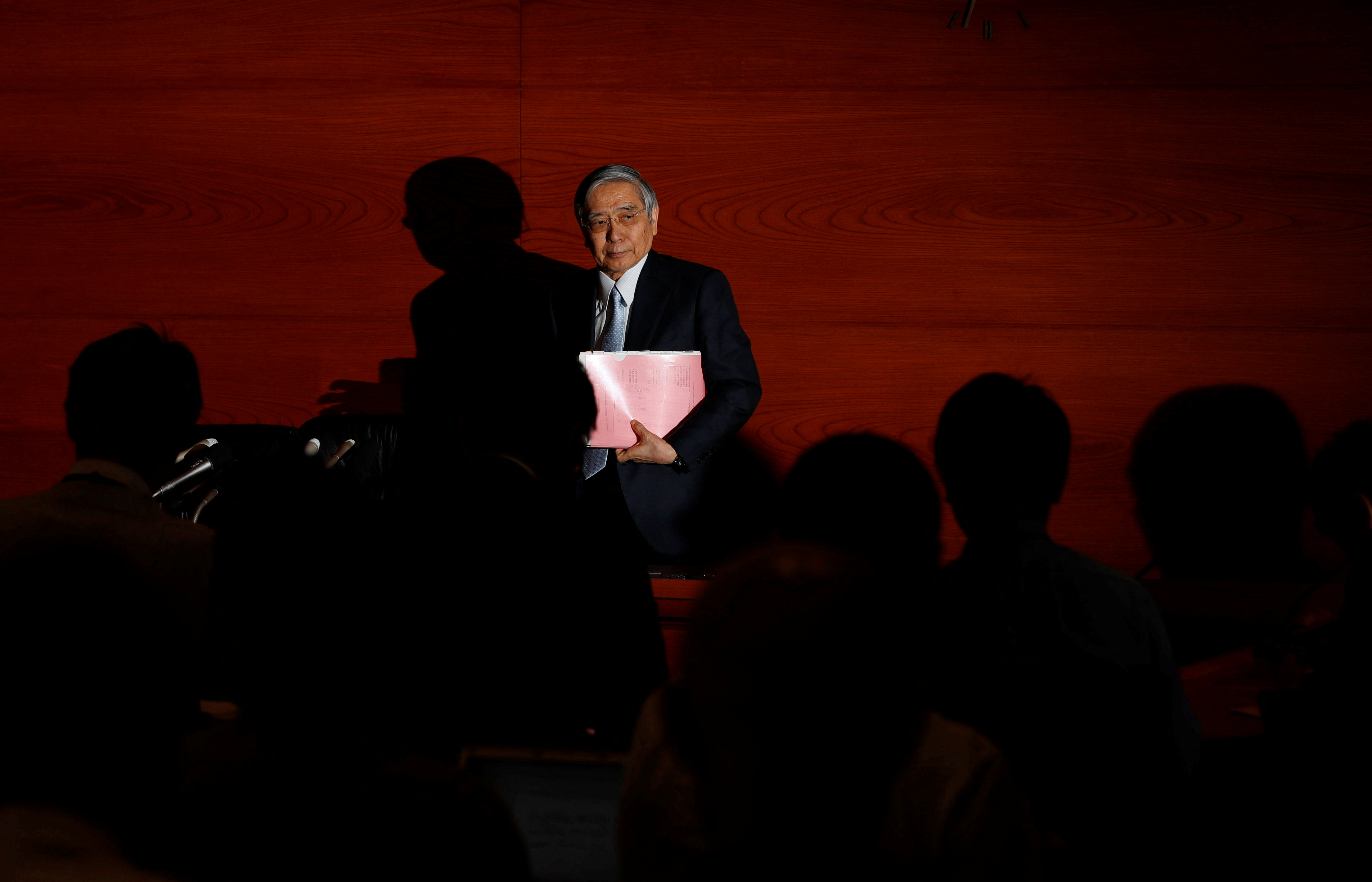 Bank of Japan (BOJ) Governor Haruhiko Kuroda leaves after a news conference at the BOJ headquarters in Tokyo