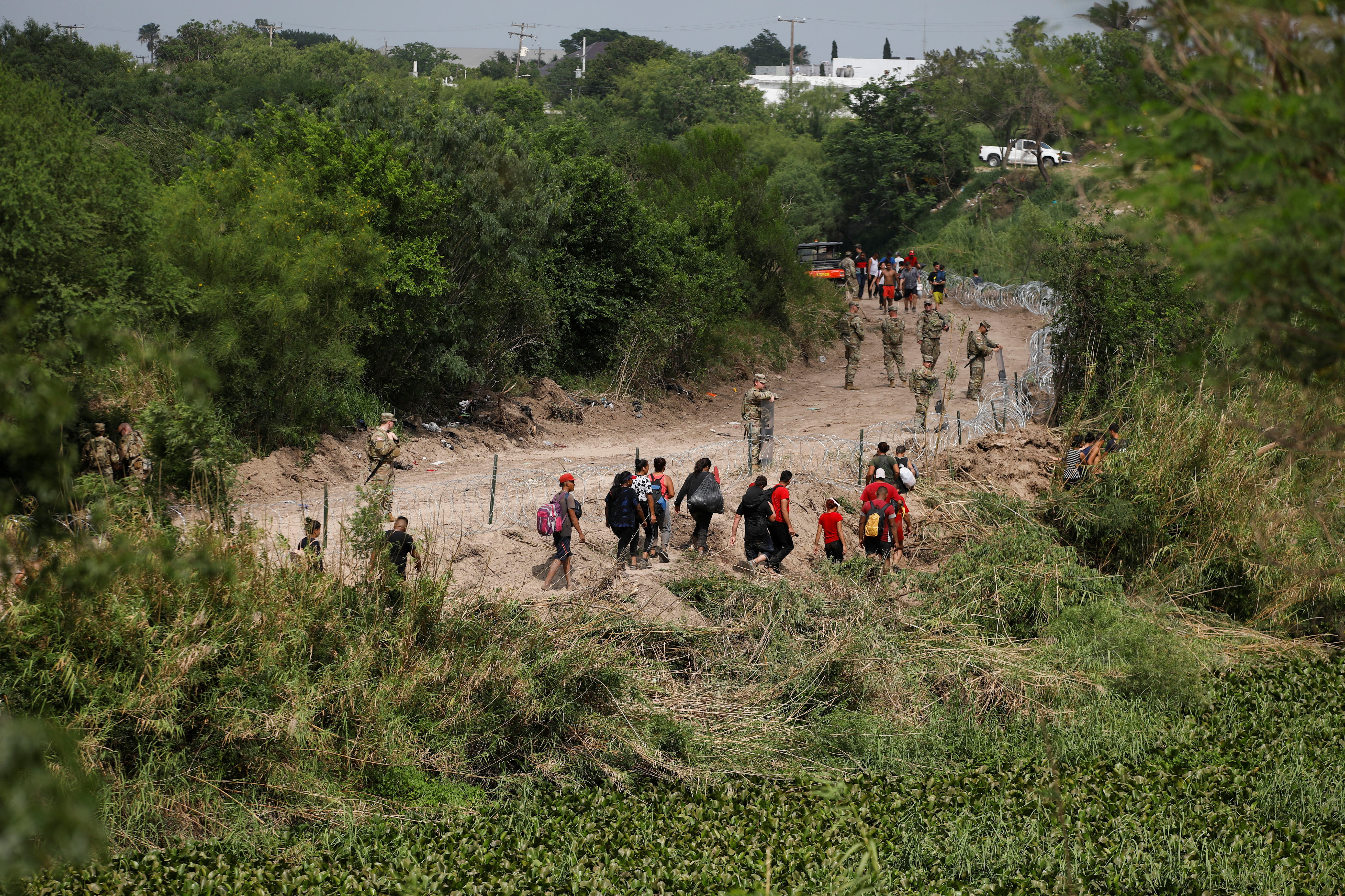 Migrants cross the Rio Bravo river before the lifting of Title 42, in Matamoros