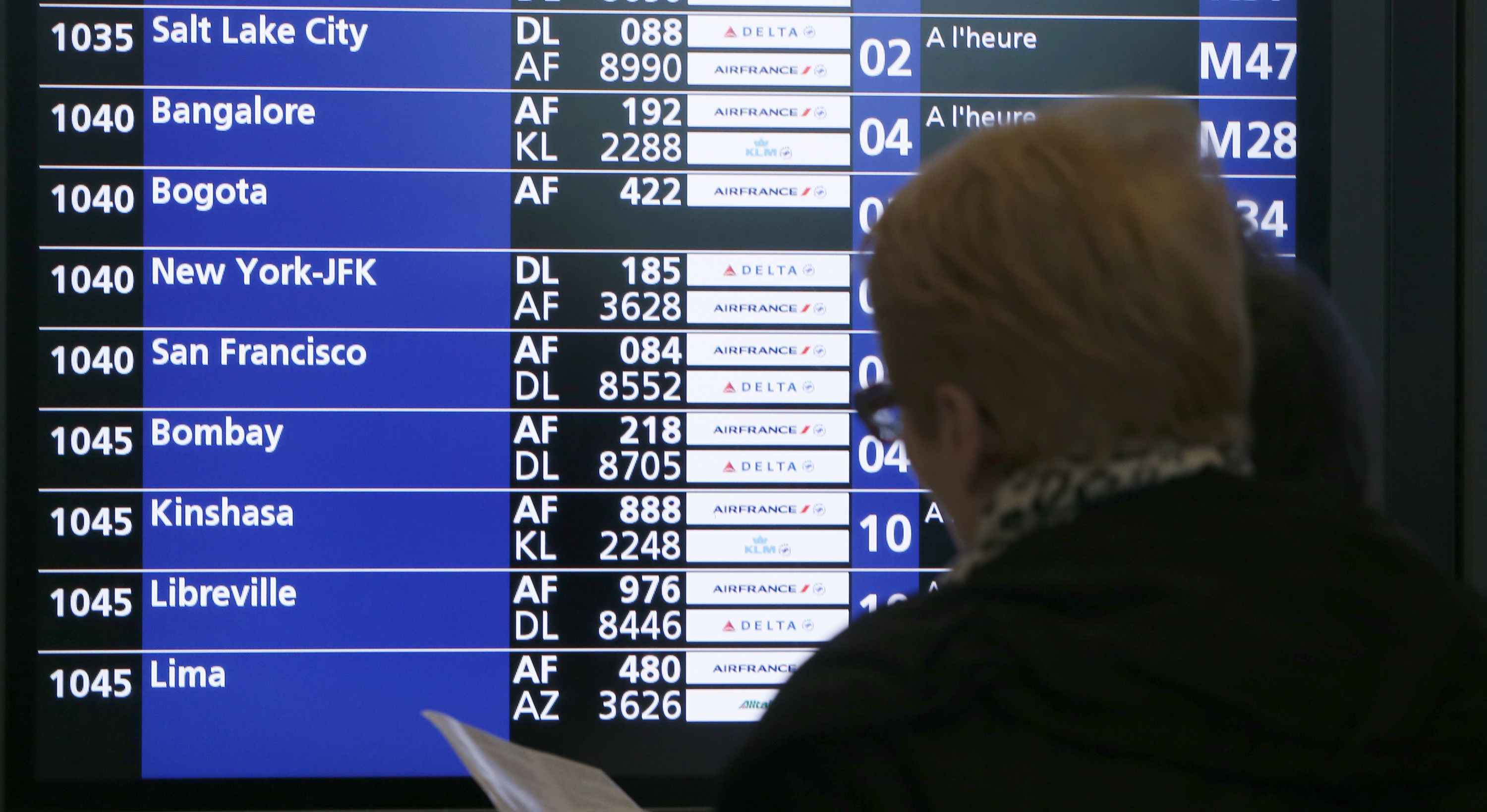 A flight departure screen displays informations at the Roissy-Charles de Gaulle International Airport north of Paris