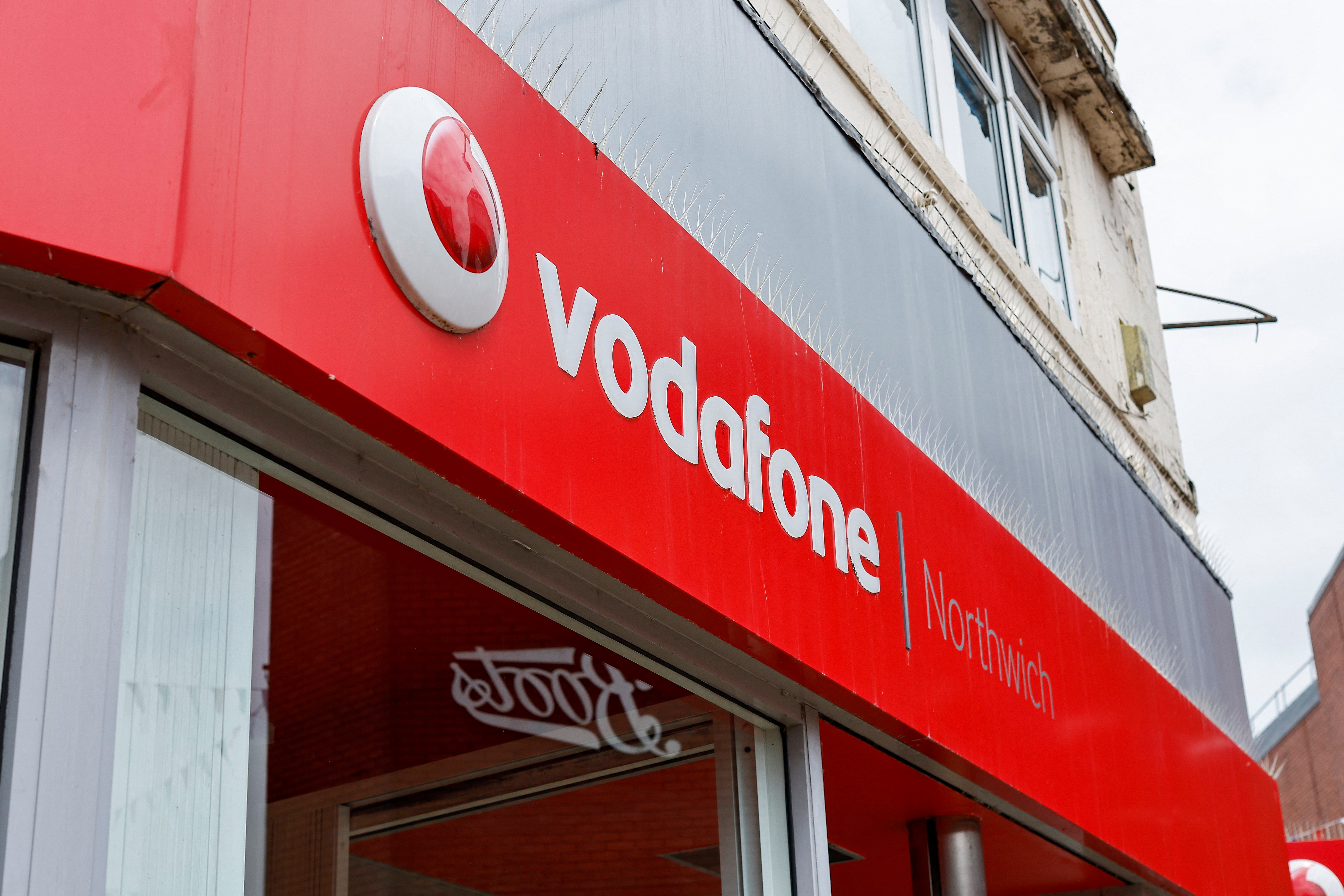 The Vodafone logo can be seen in a Vodafone store in Northwich
