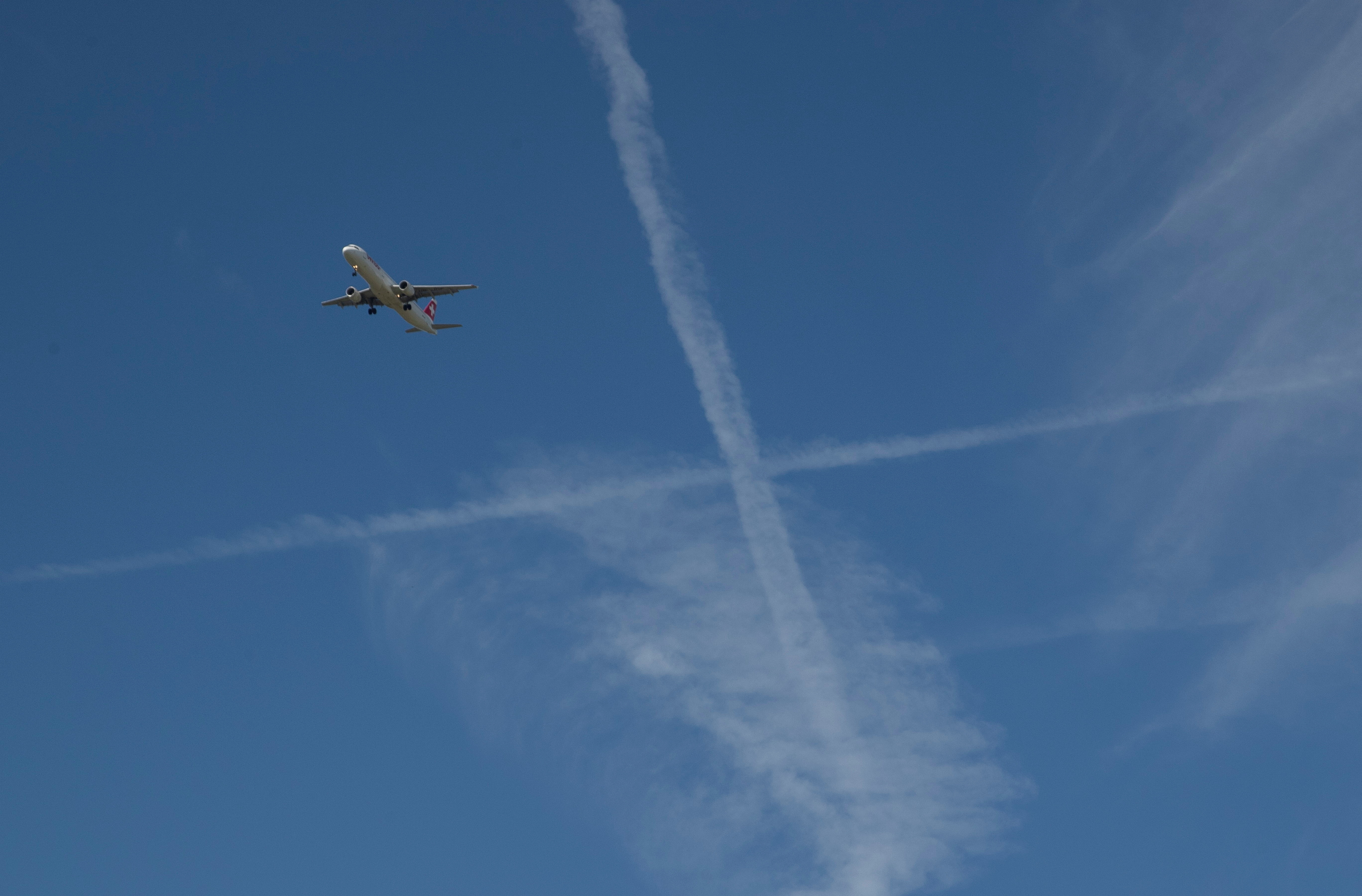An aircraft of Swiss Airlines is flying above Stadel