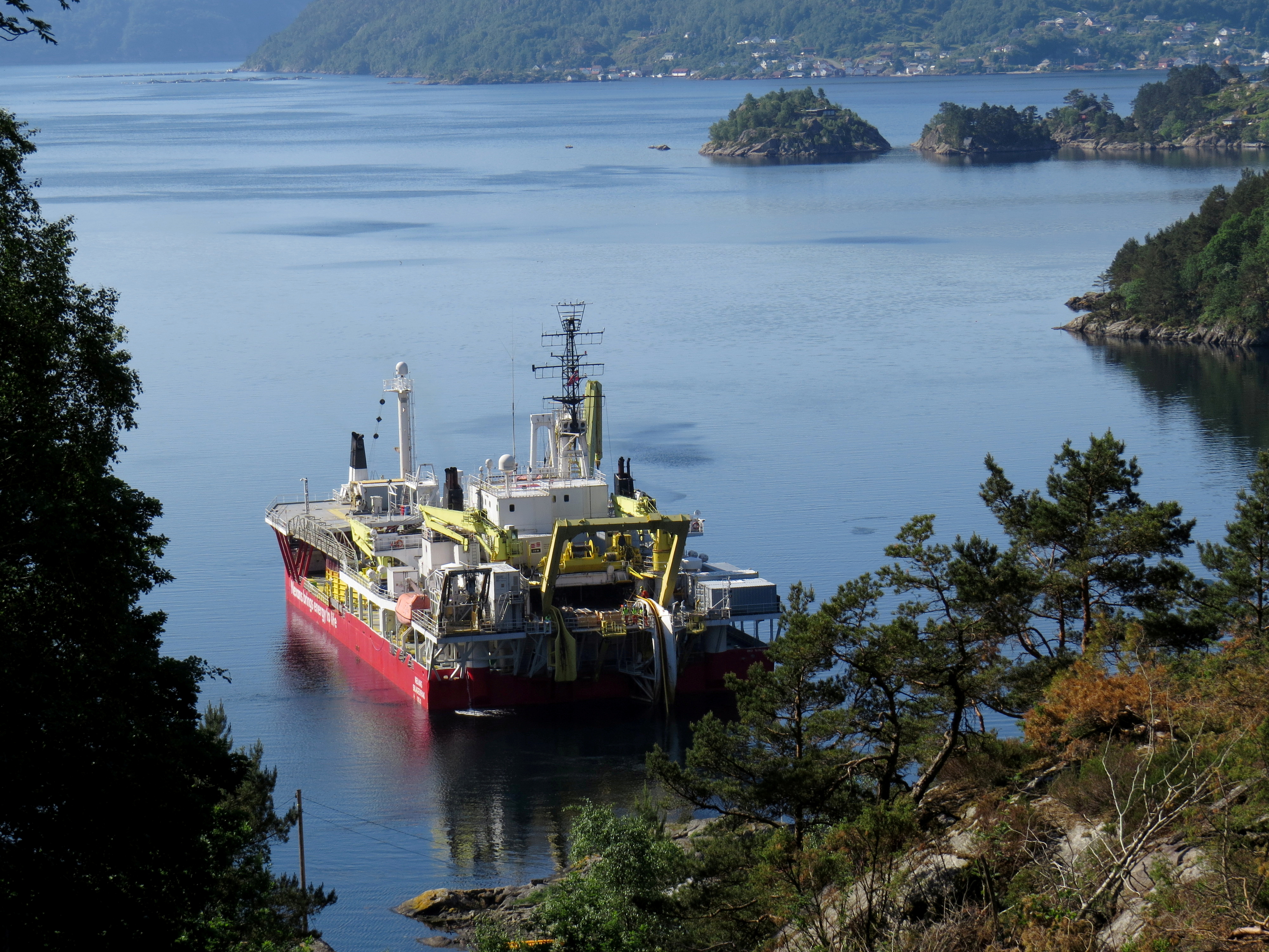 Workers on Nexans Skagerrak vessel lay a NordLink subsea interconnector power cable to connect Norway and Germany at the Vollesfjord fjord near Flekkefjord, Norway