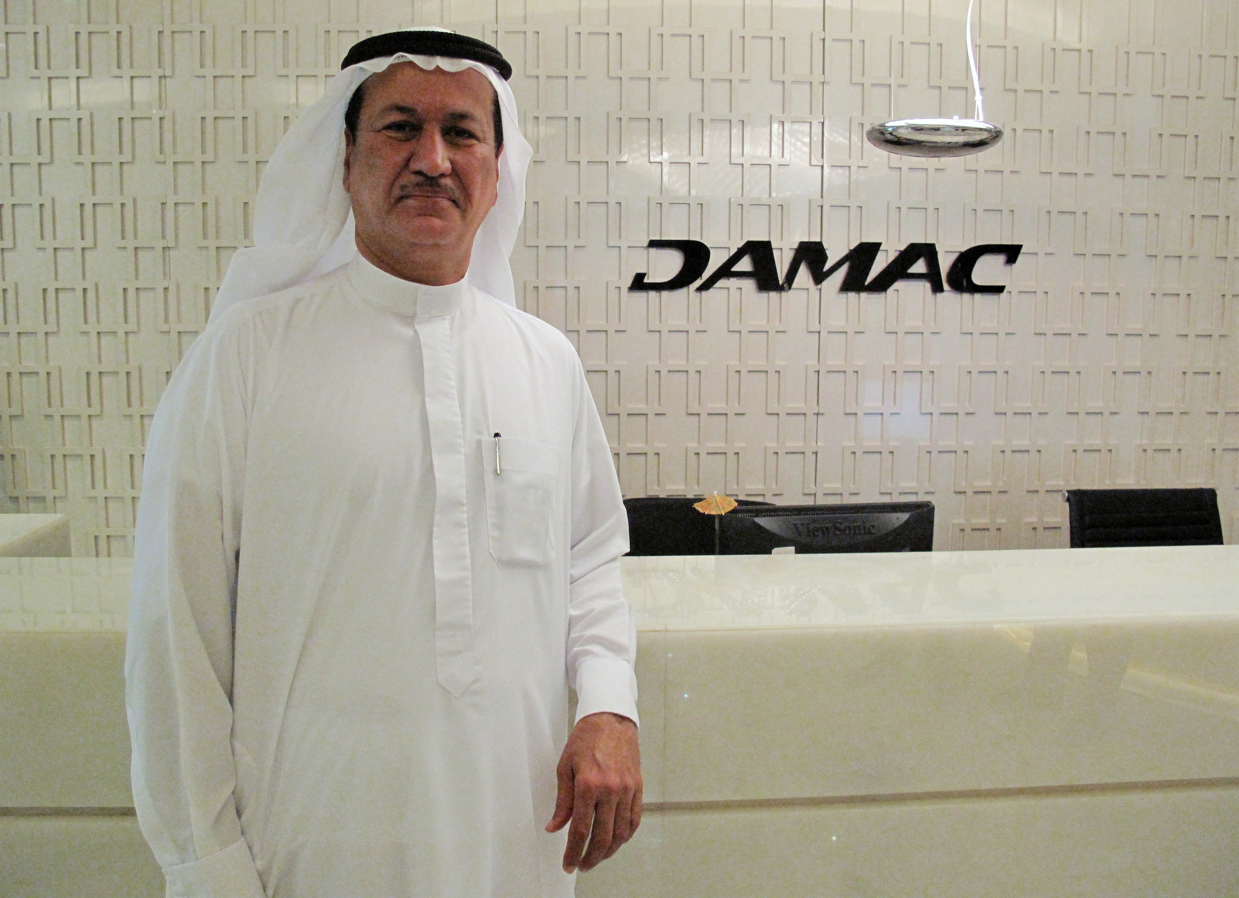 Hussain Sajwani, founder and chairman of Dubai's DAMAC Properties poses for the camera during an interview with Reuters at his office in Dubai