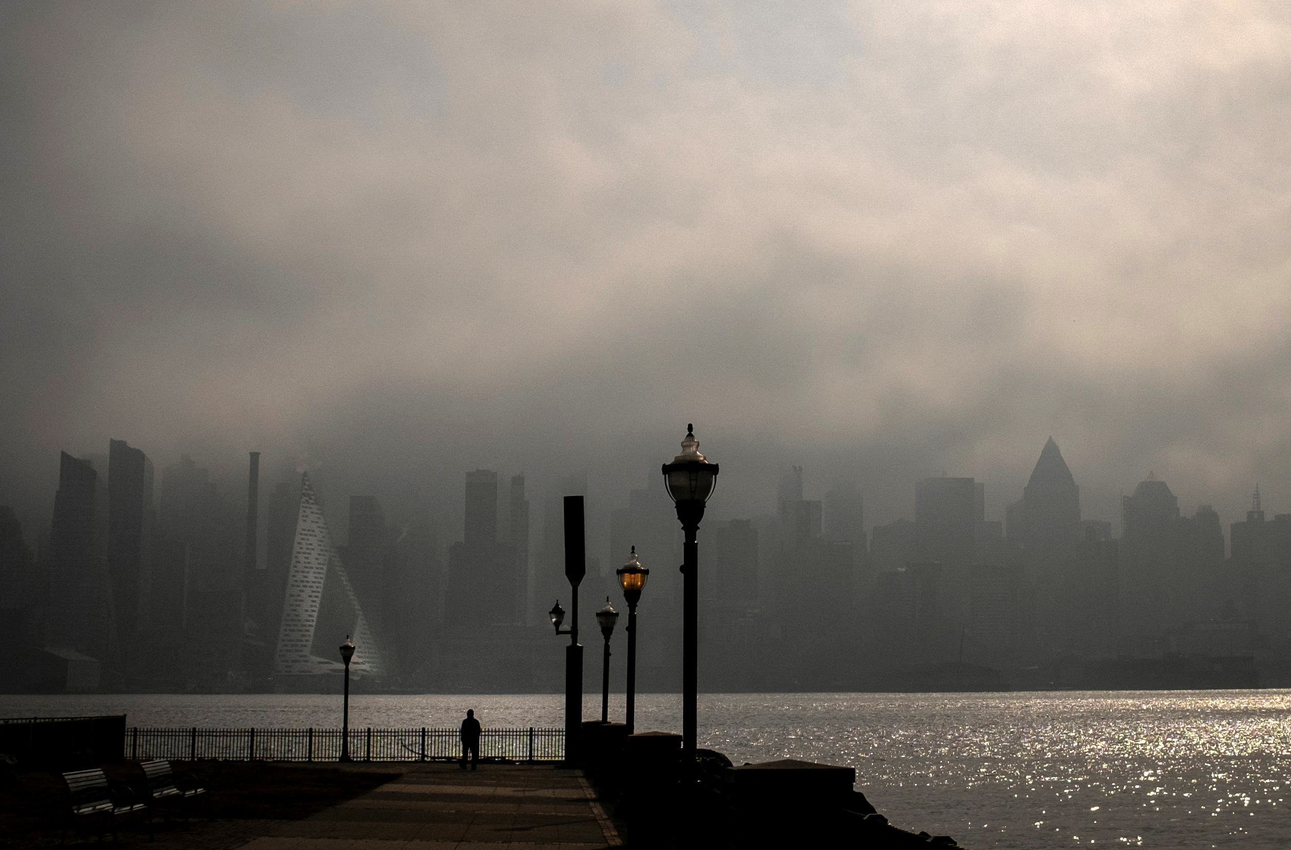 Heavy fog hangs over New York City, as seen from Weehawken, New Jersey