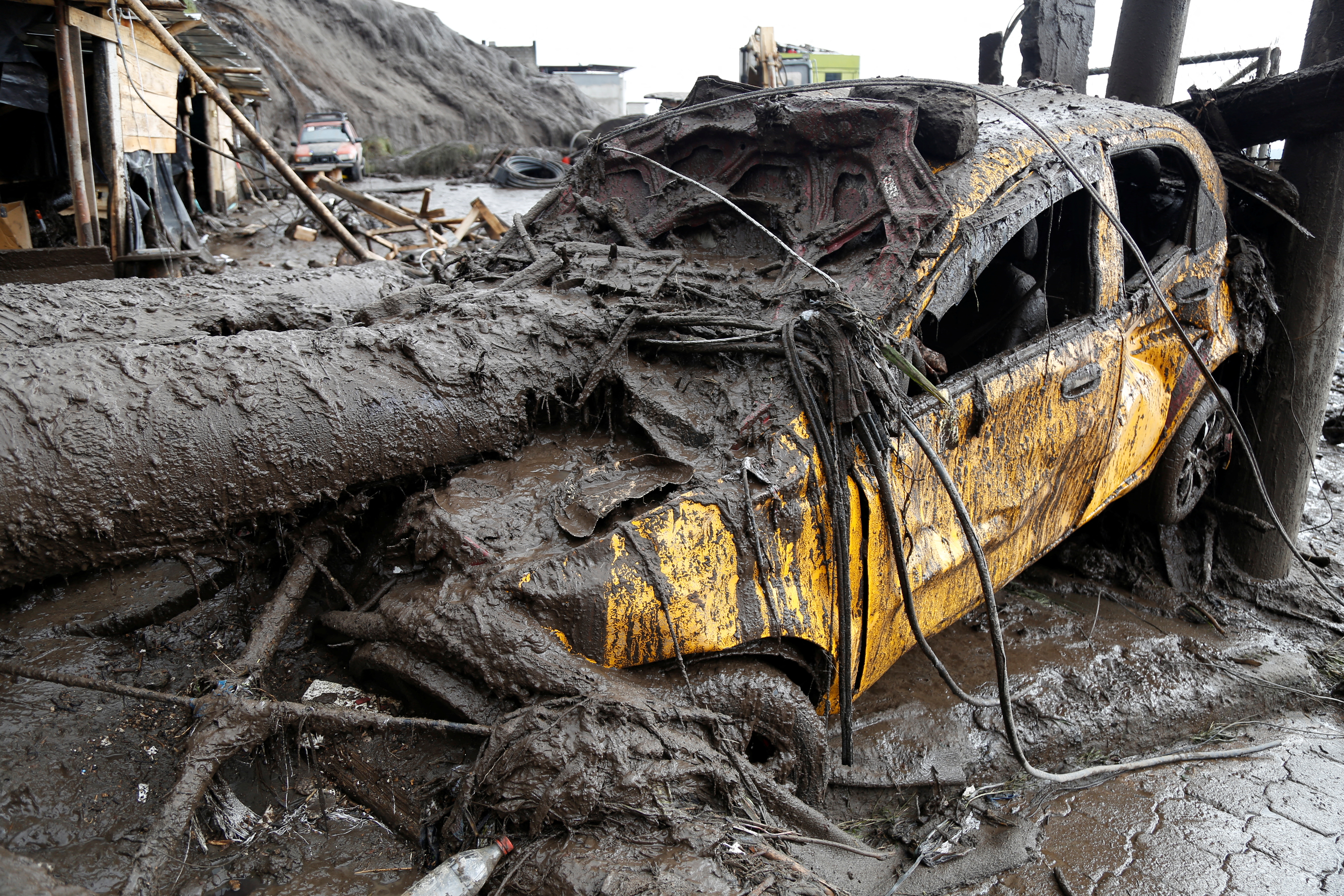 A car is seen in an area of a landslide ​in Quito, Ecuador, February 1, 2022. REUTERS/Jonatan Rosas