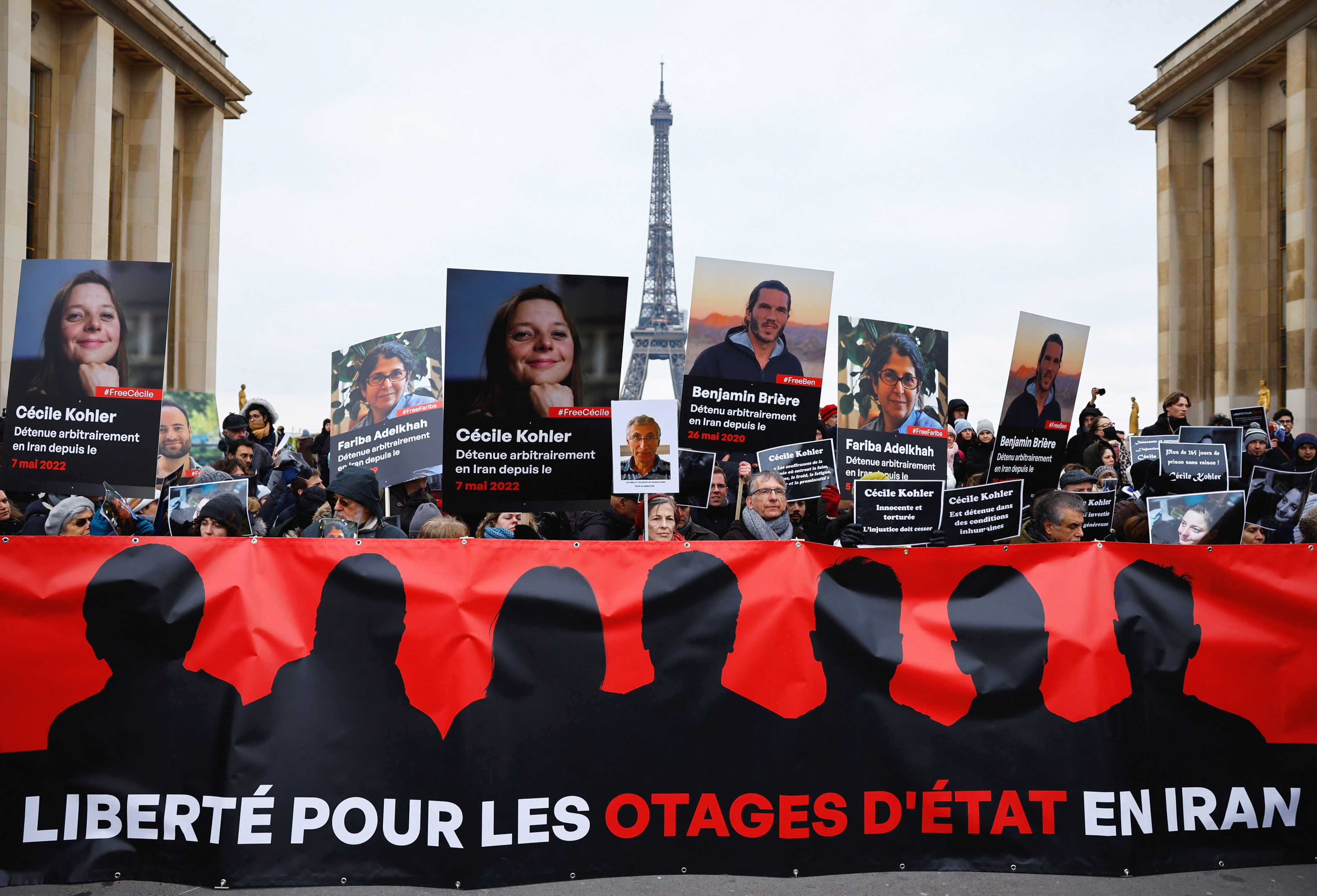 Supporters and relatives of French citizens detained in Iran gather in Paris