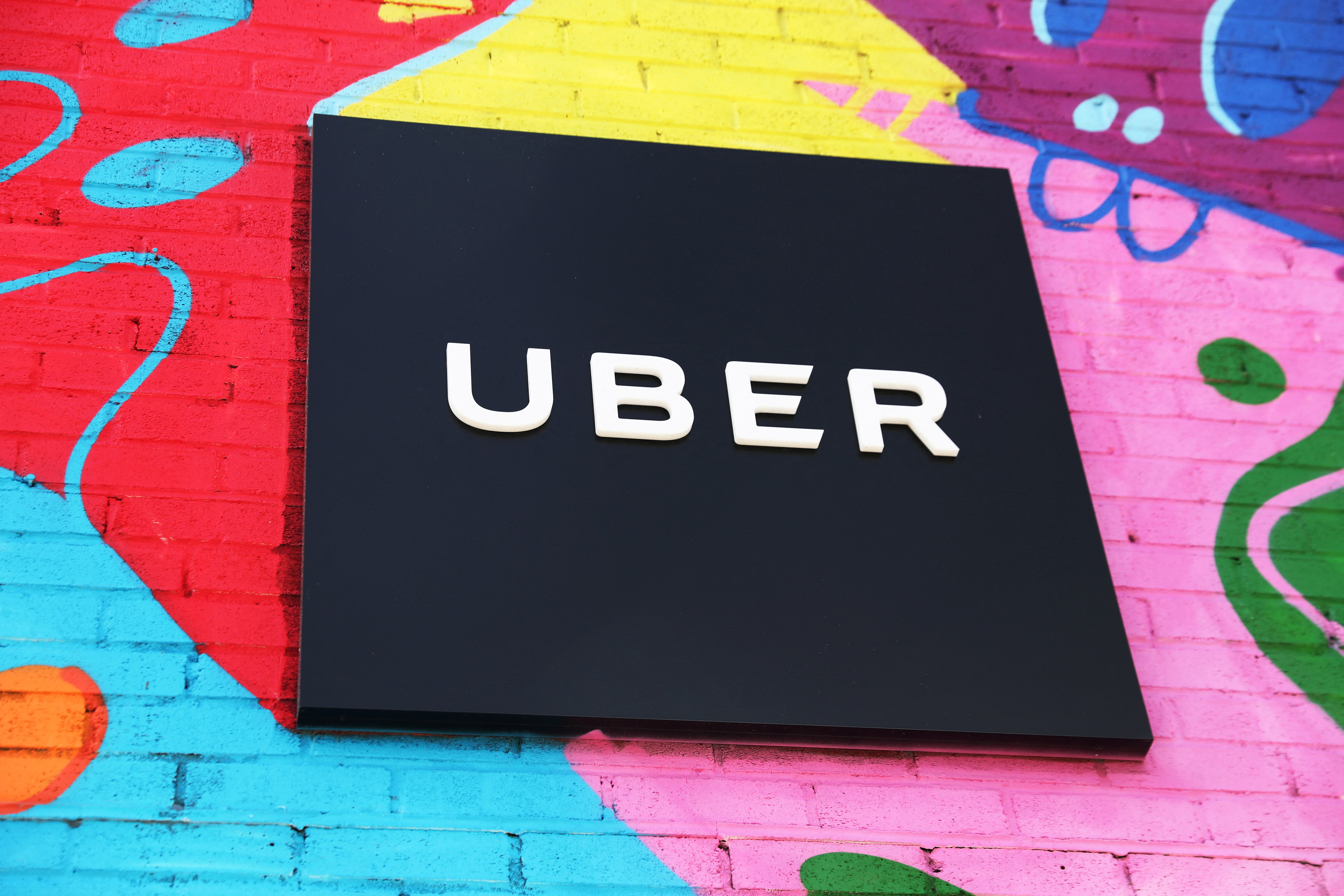 Uber sign is seen on the outside of their Greenlight Hub in the Brooklyn borough of New York