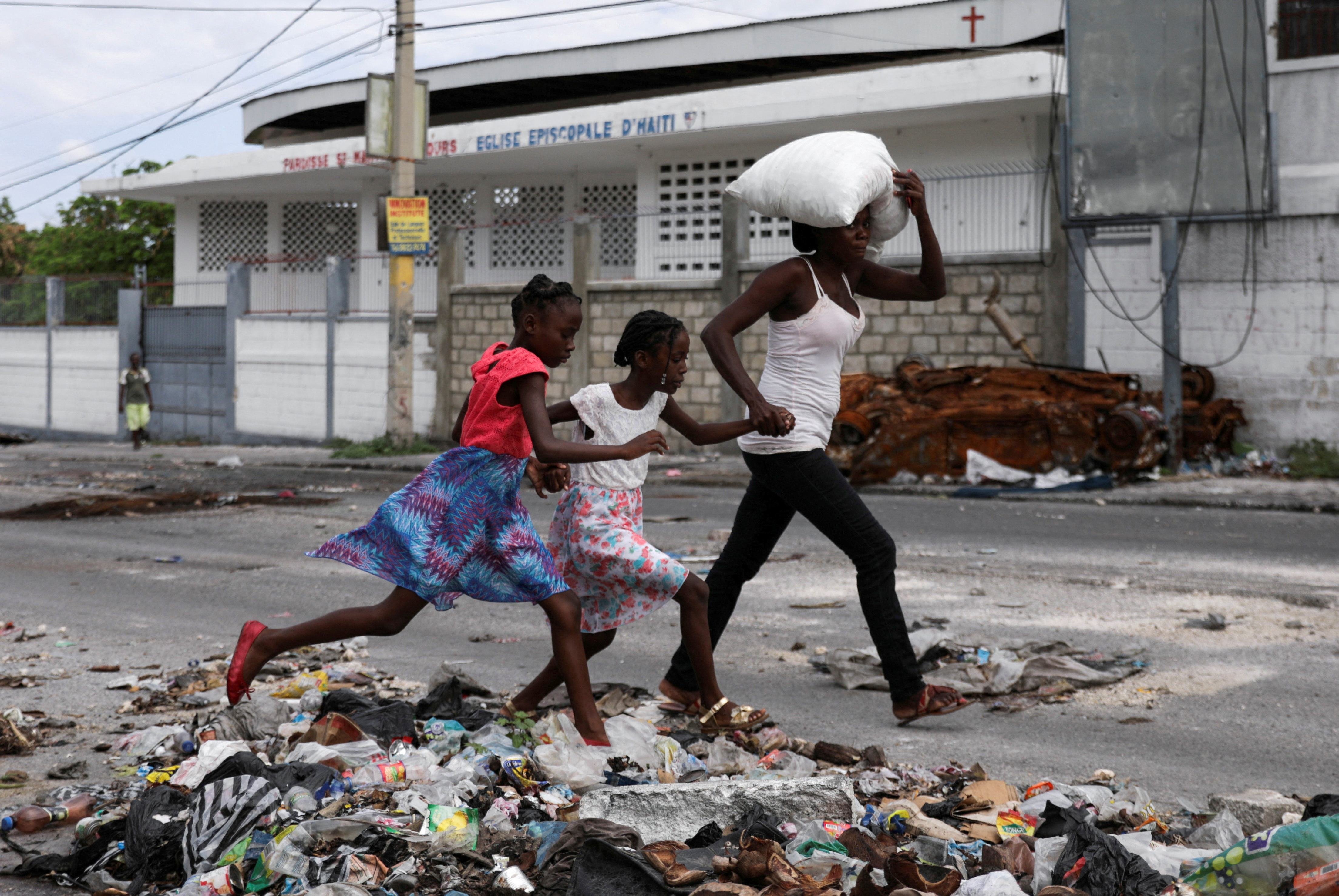 Residents flee homes due to gang violence, in Port-au-Prince
