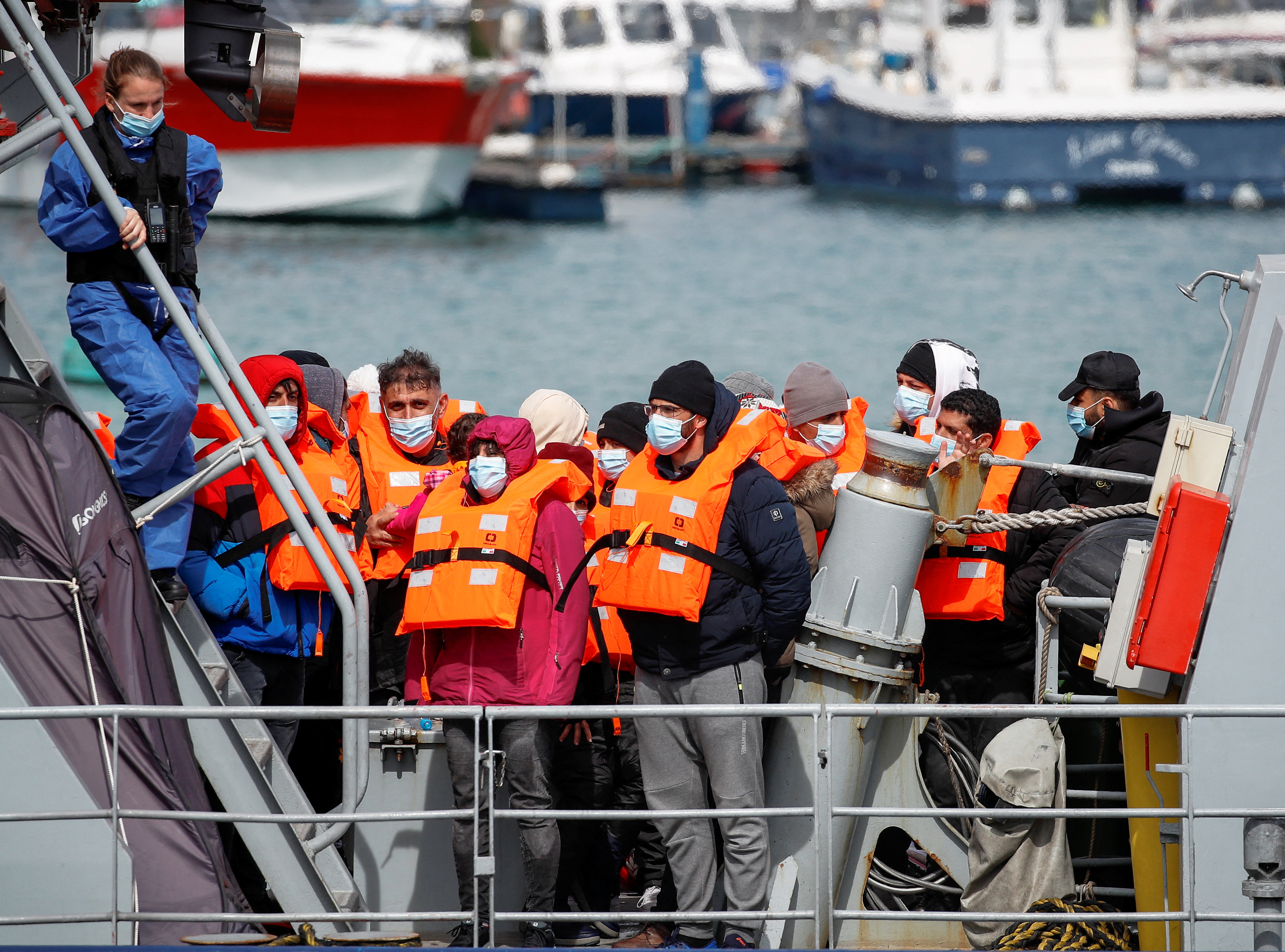 Migrants arrive in Dover after being rescued while crossing the English Channel