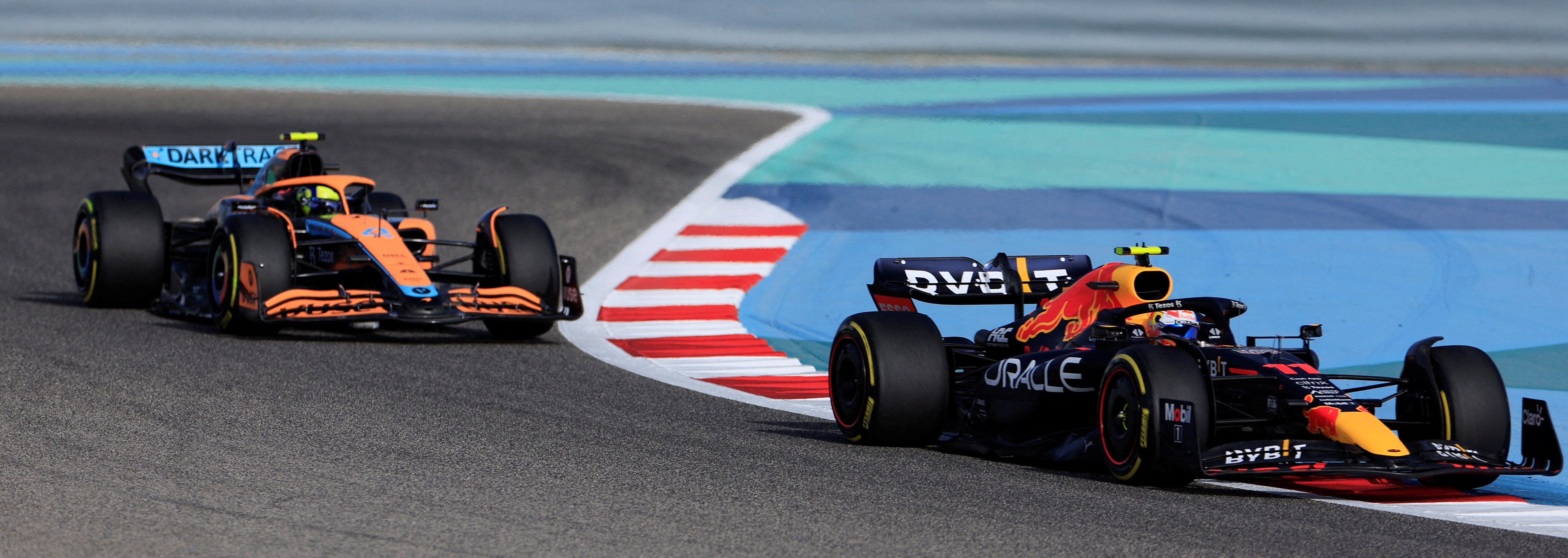 Red Bull's Sergio Perez and McLaren's Lando Norris during practice at the Bahrain Grand Prix