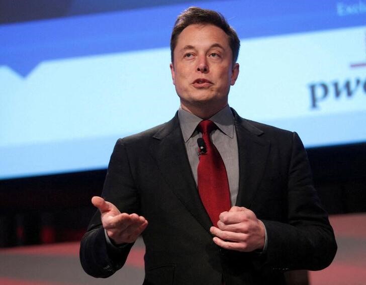 Elon Musk talks at the Automotive World News Congress at the Renaissance Center in Detroit