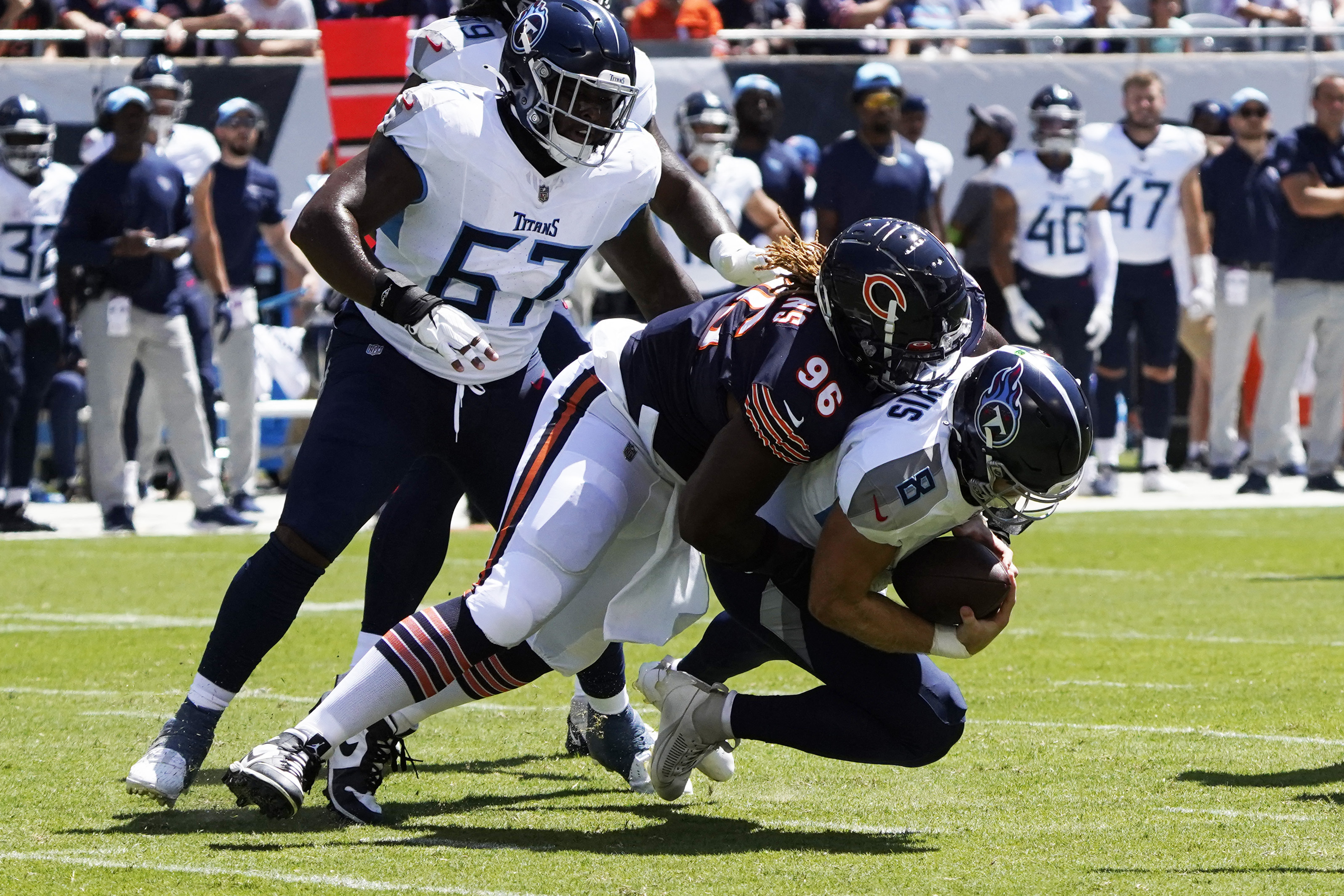 Chicago Bears defensive back Tre Roberson, left, scores a touchdown after  intercepting a pass against the Tennessee Titans in the first half of a  preseason NFL football game Saturday, Aug. 28, 2021