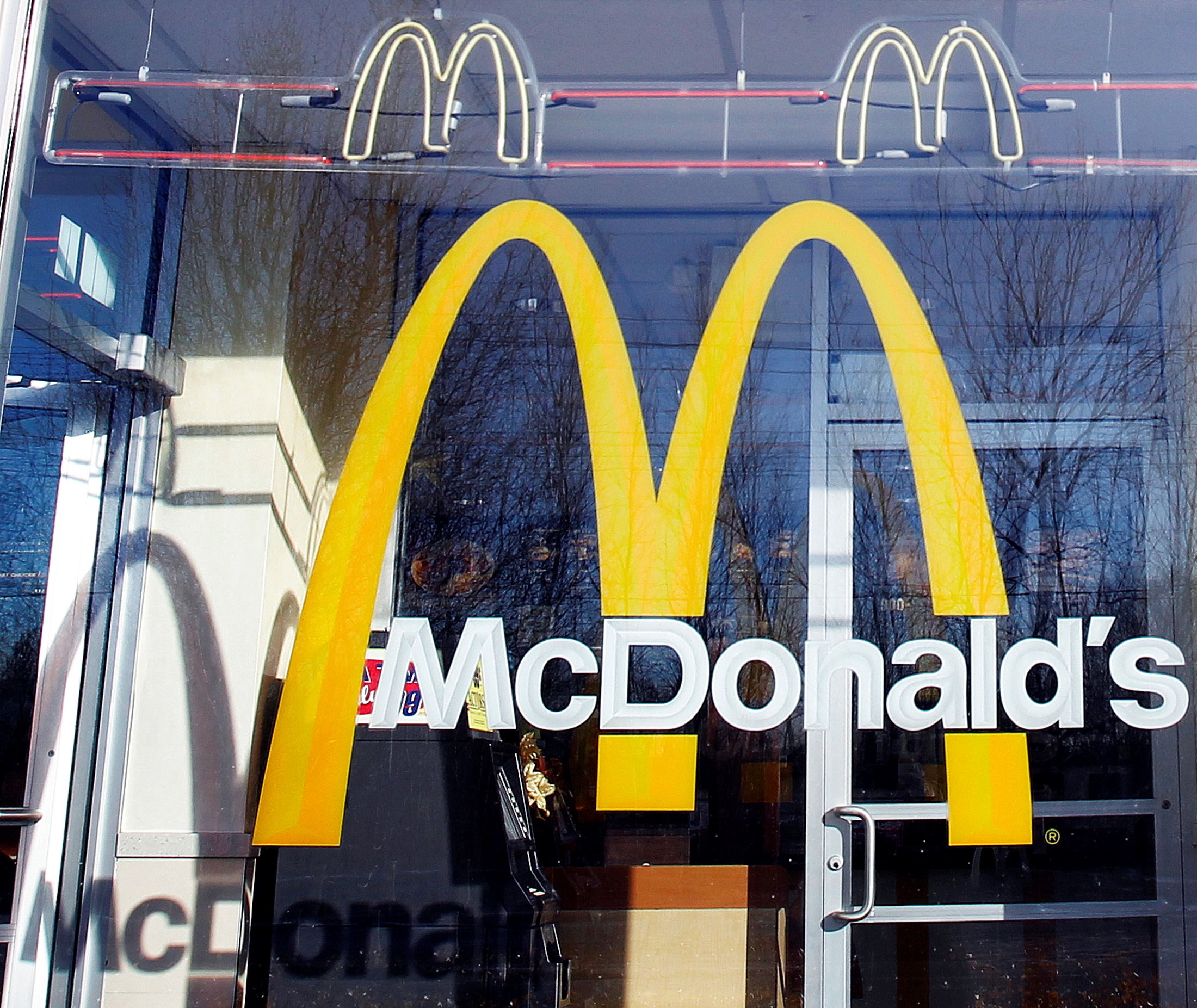 McDonald's logo is seen on the window of one of its restaurants in New York January 24, 2011.  REUTERS/Shannon Stapleton