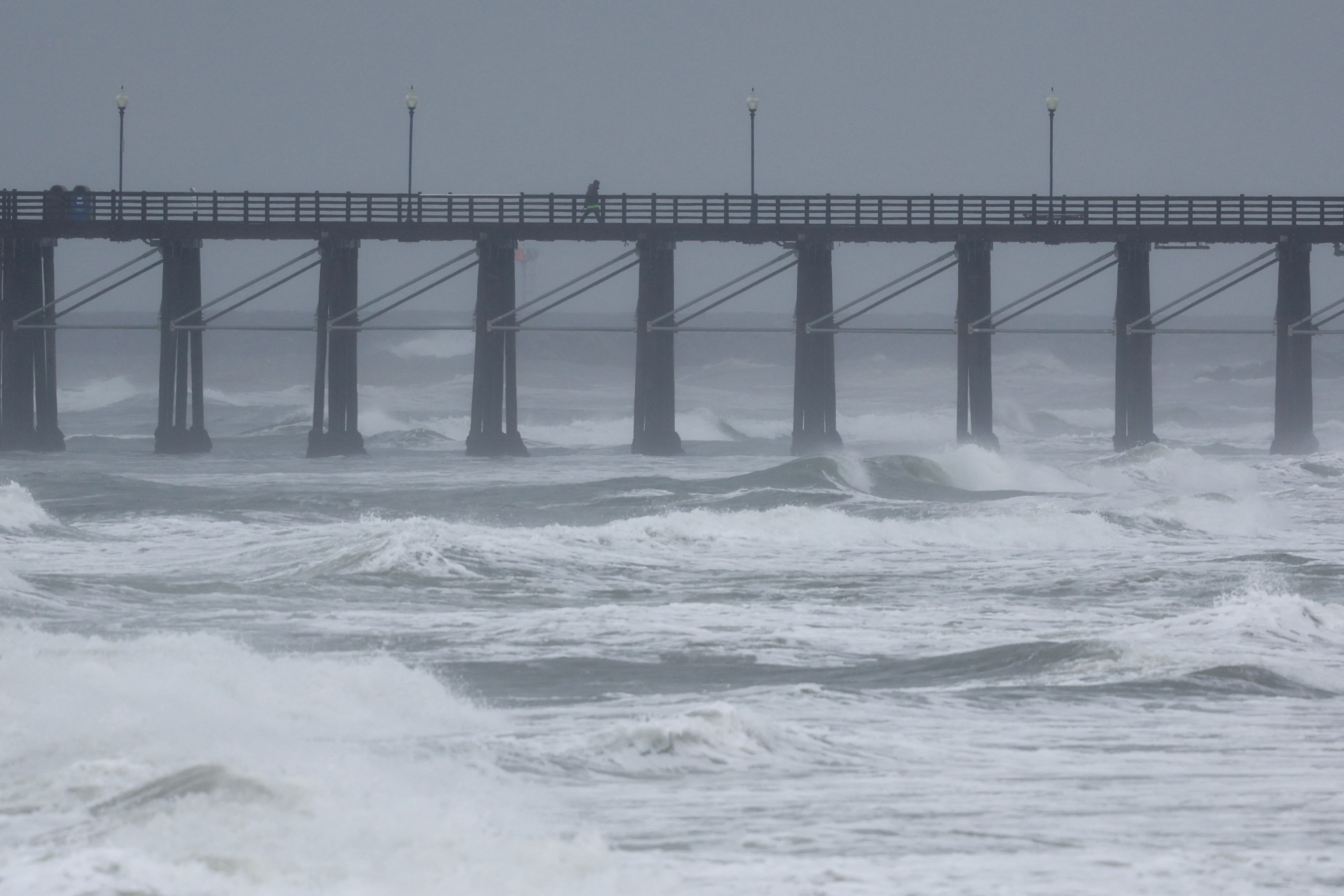 Lingering atmospheric river soaks California, threatening more flooding ...