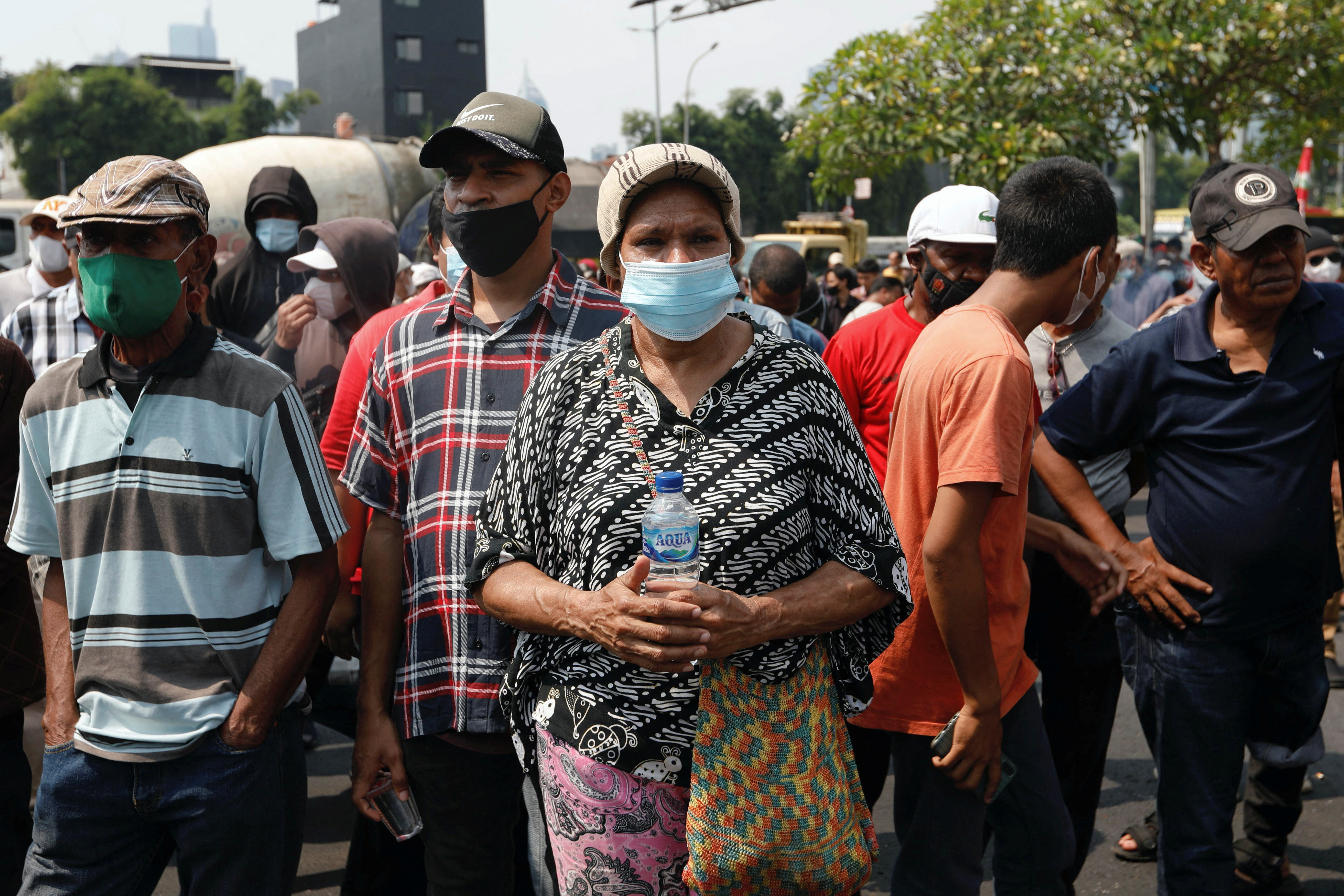 Demonstrators protest outside the Indonesian Parliament following a bill passed by legislators to create three new provinces in its underdeveloped region of Papua, in Jakarta