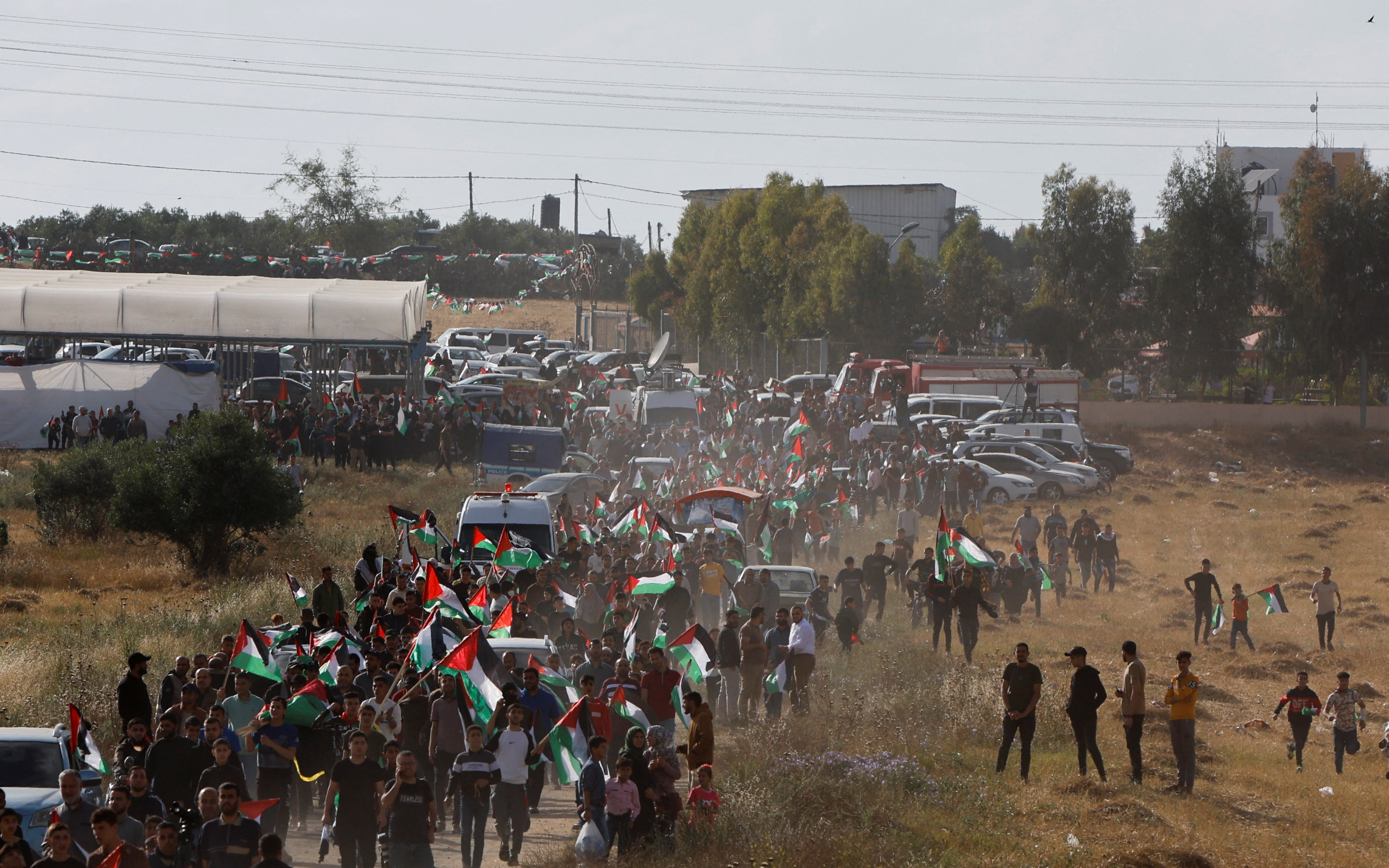 Palestinians take part in a protest against the holding of the annual flag march in Jerusalem which marks Jerusalem Day