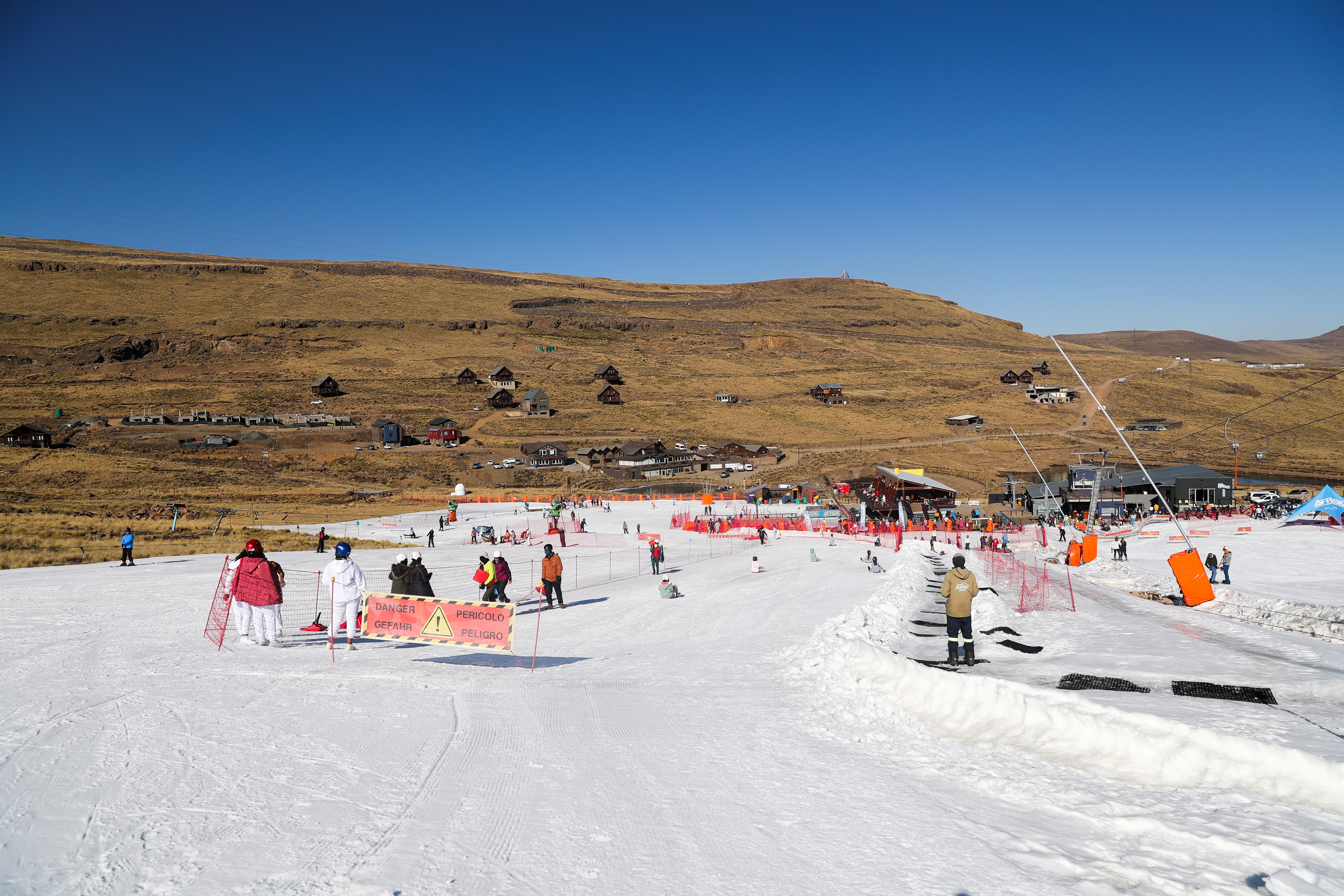 People ski and snowboard at Kapoko Snow Park at Afriski Mountain Resort in Butha Buthe