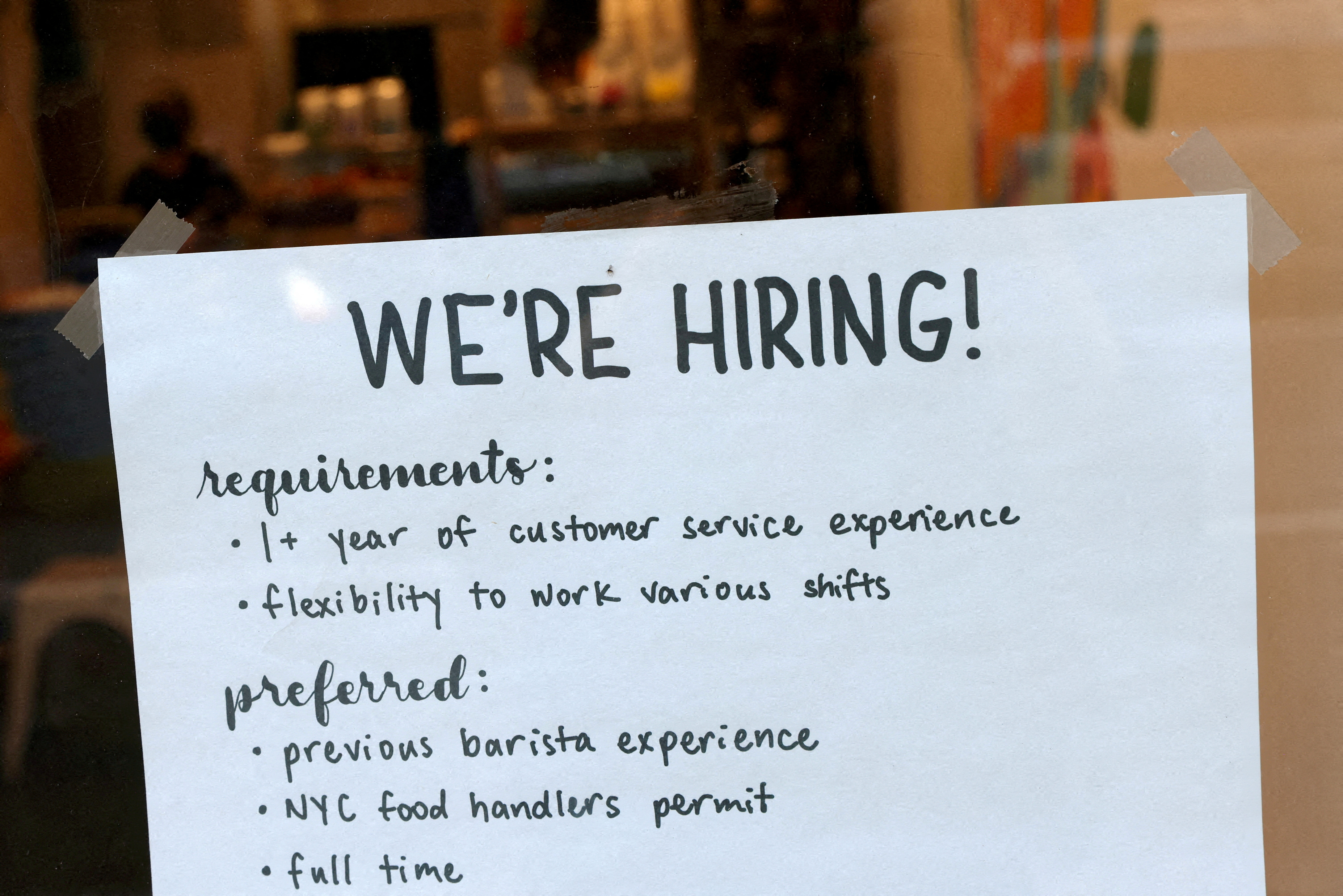 A hiring sign is seen in a cafe in Manhattan, New York City