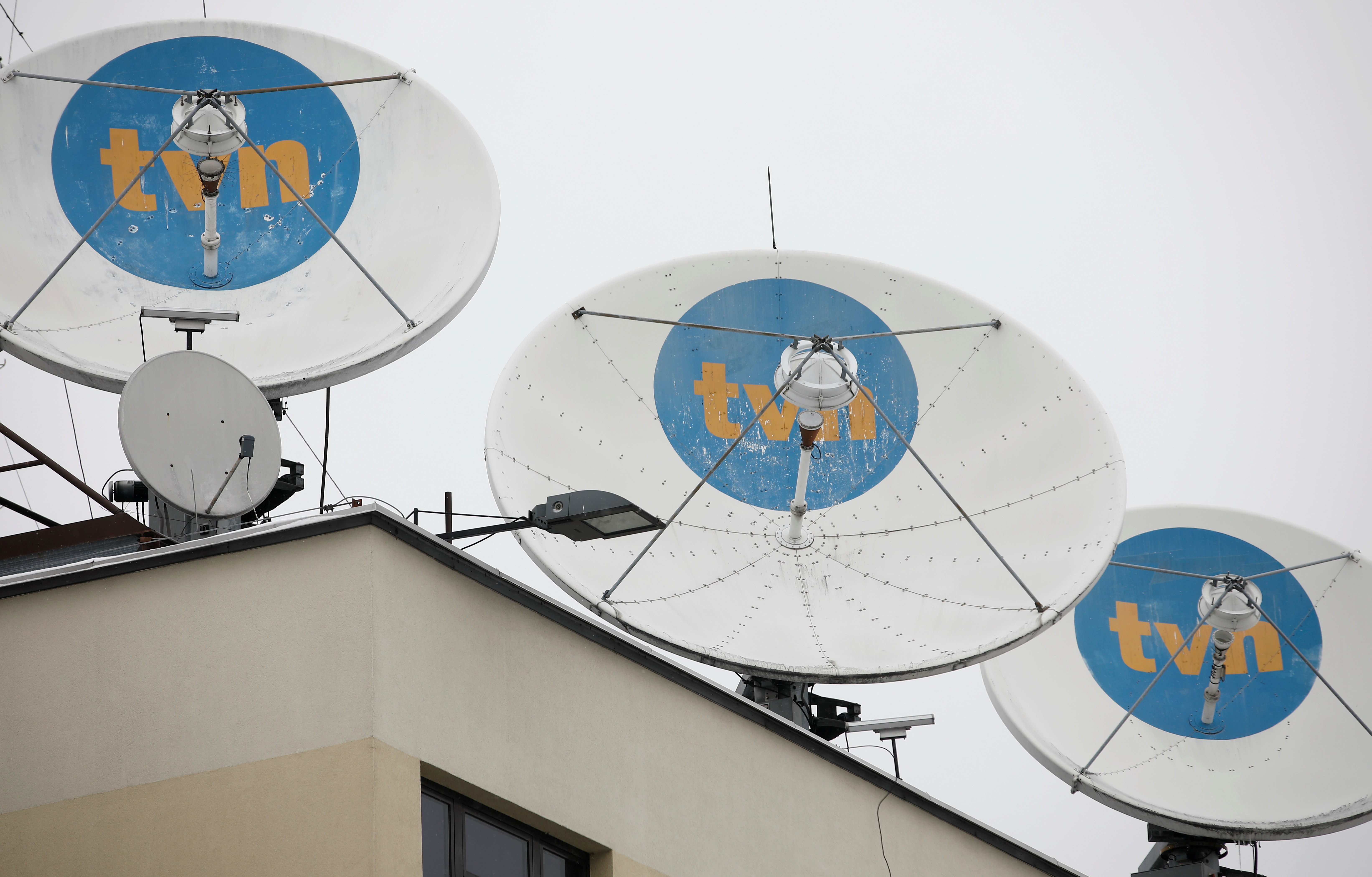 Private television TVN logo is seen on satellite antennas at their headquarters in Warsaw