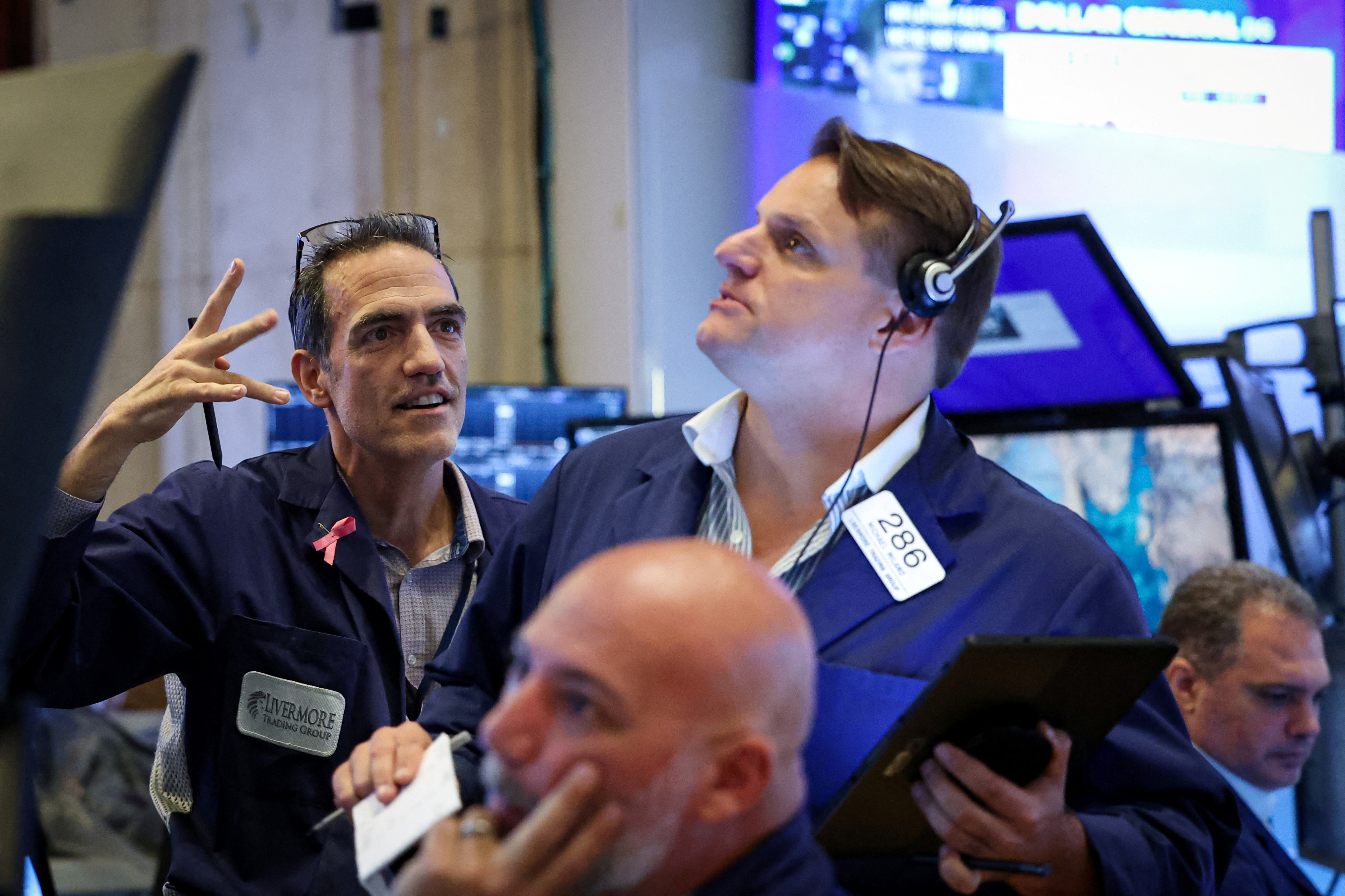 Traders work on the floor of the NYSE in New York