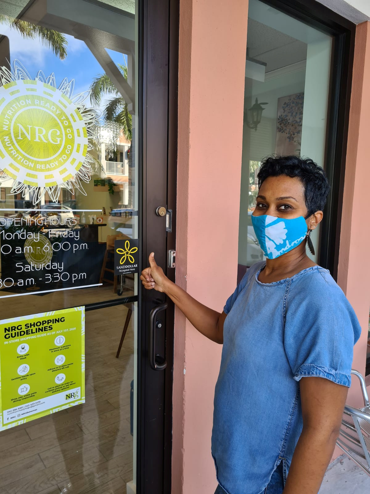 Dawn Sands, owner, poses for a photograph outside NRG cafe in Nassau, the Bahamas in November 2020 in this handout image obtained by Reuters on December 17, 2020. Central Bank of The Bahamas (CBoB)/Handout via REUTERS