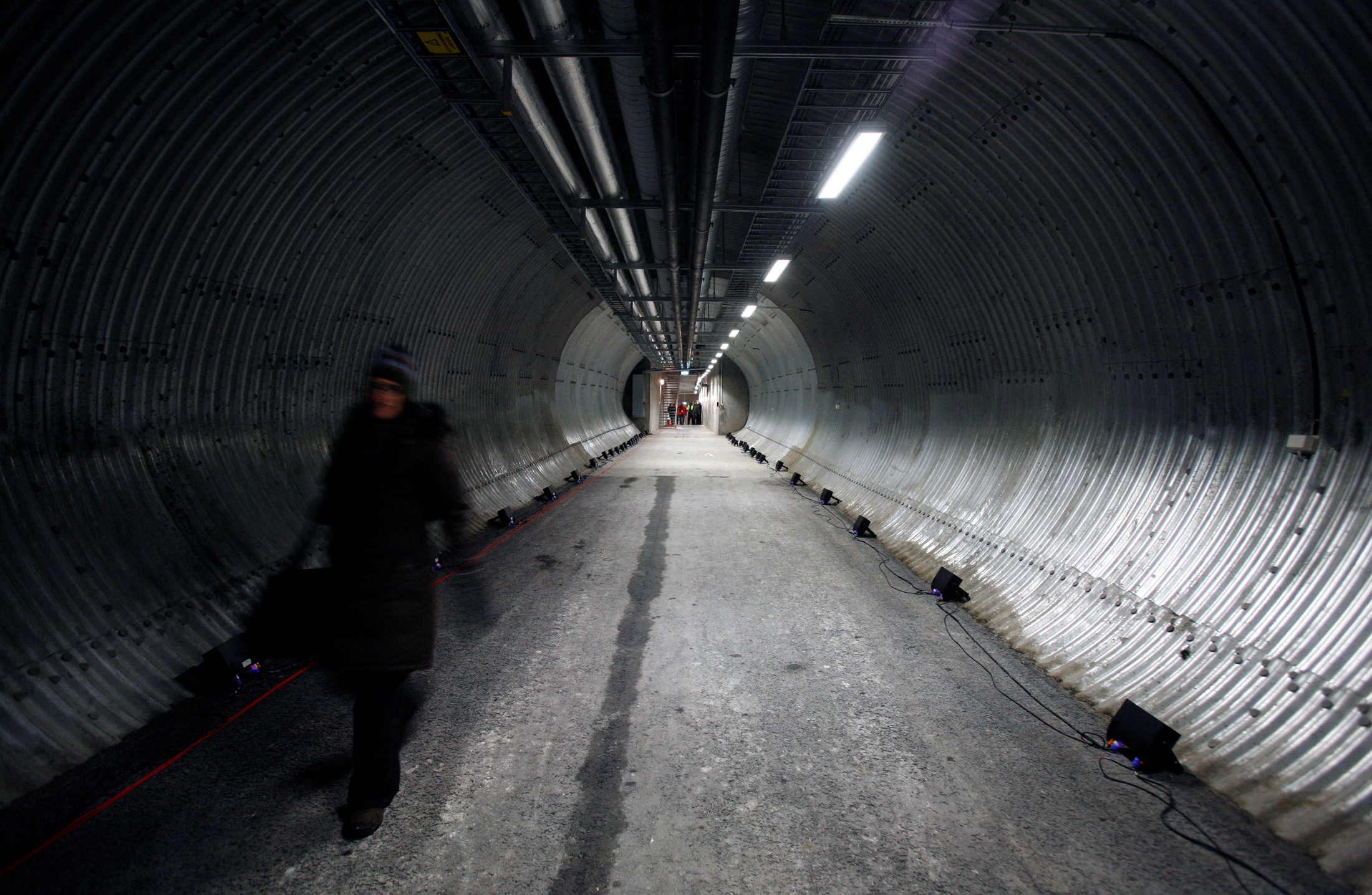 A person walks along the passage leading into the Global Seed Vault in Longyearbyen