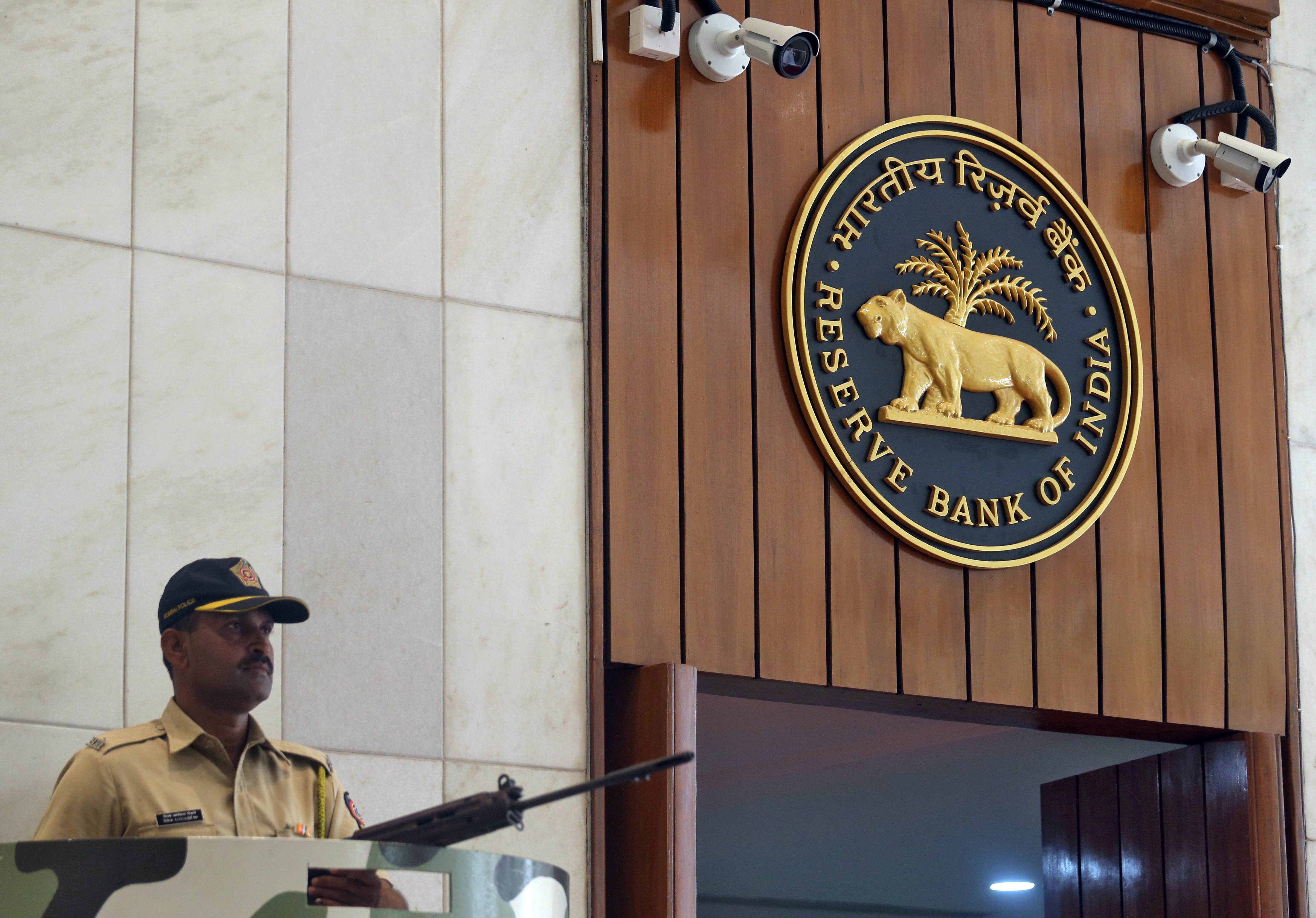 A policeman stands guard at the entrance of the Reserve Bank of India headquarters in Mumbai